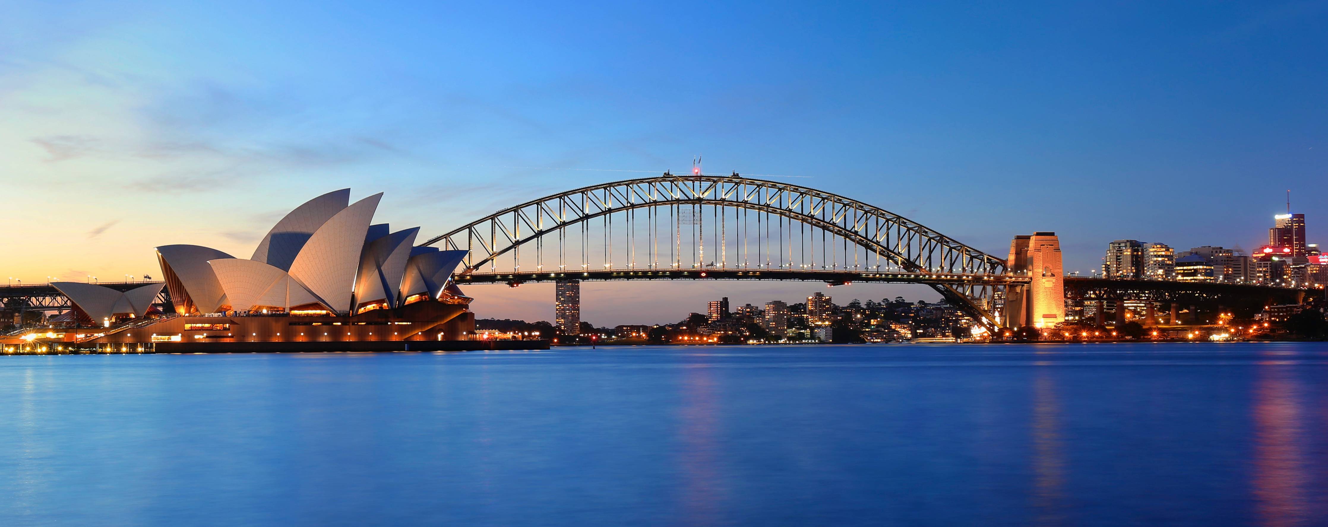 Wandverkleidung Wohnzimmer-Sydney Opernhaus und Harbour Bridge bei Sonnenuntergang