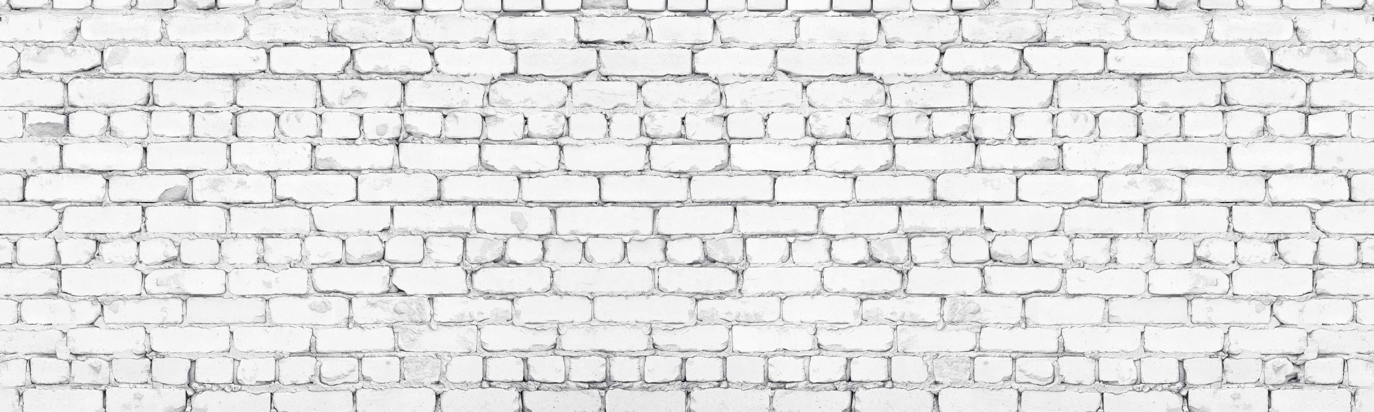 Wandverkleidung Wohnzimmer-Weiße raue Backsteinmauer