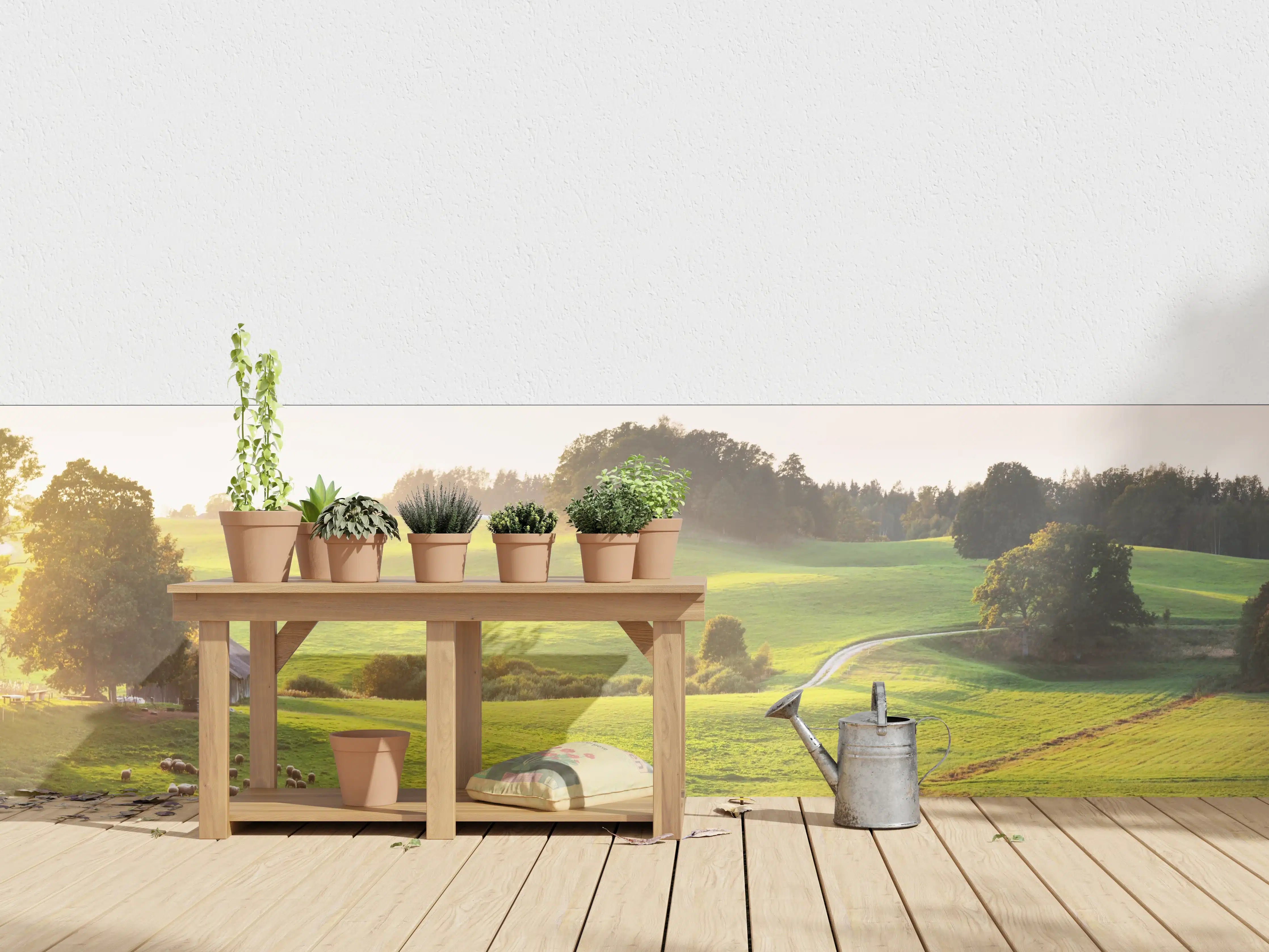 Wandverkleidung außen - Landschaft bei Sonnenaufgang mit grünen Hügeln und Bäumen
