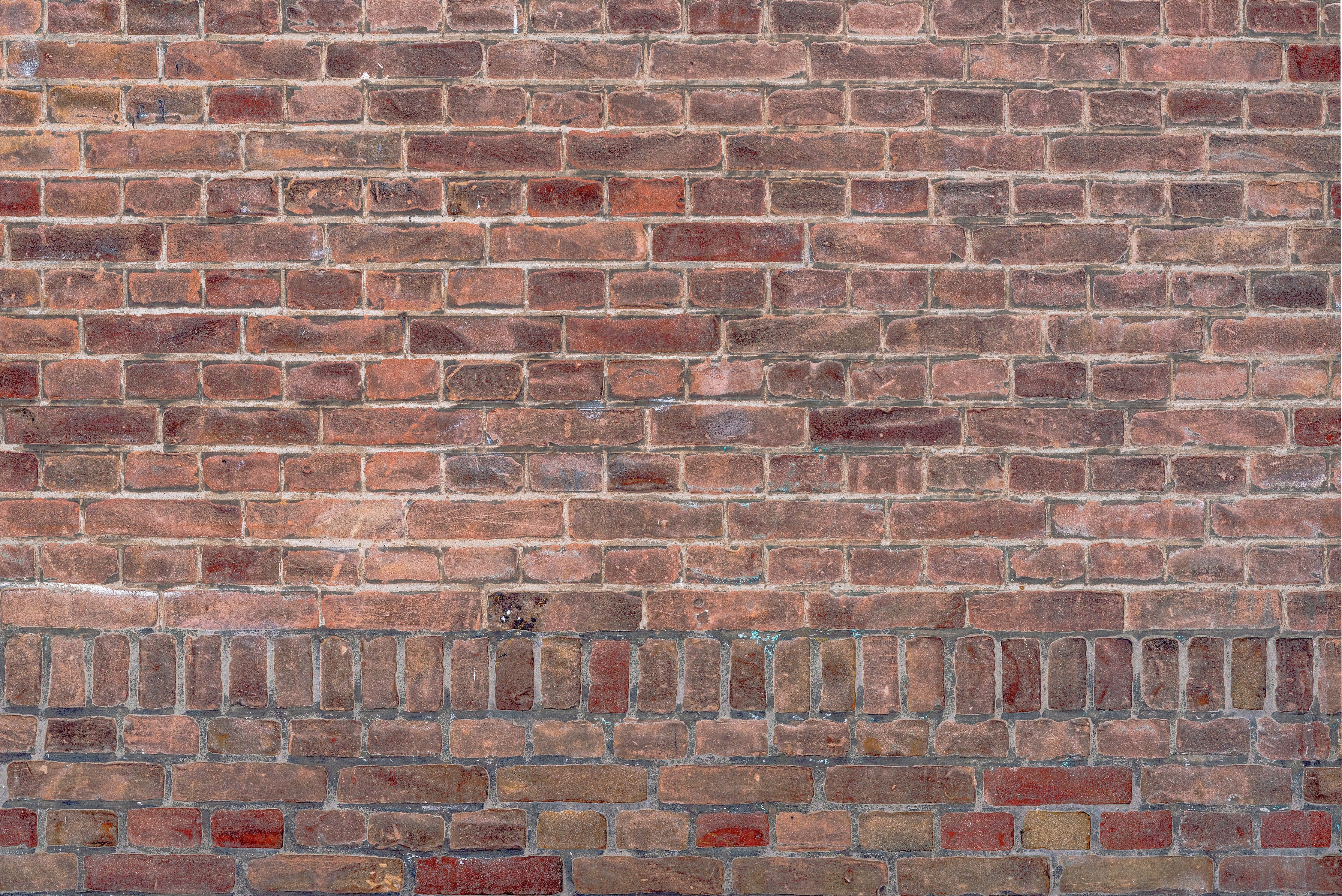 Waschbecken-Rückwand-Graue Backsteinstruktur mit weißen Akzenten