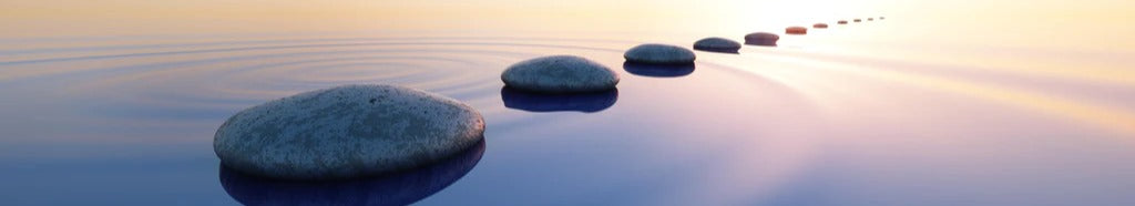 Küchenrückwand - Steine im See bei Sonnenaufgang