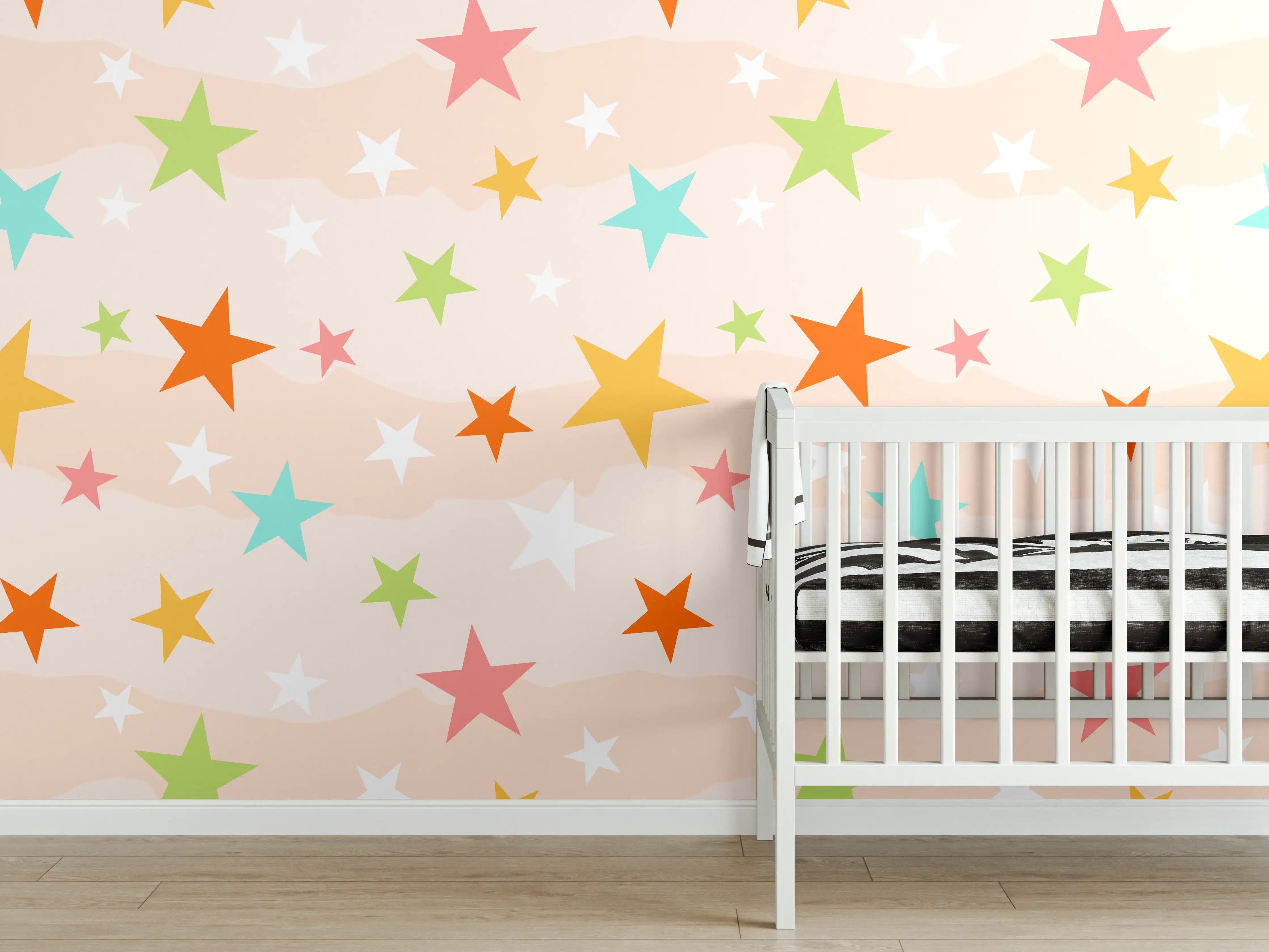 Babyzimmer Wandgestaltung - Bunte Sternenmuster auf pastellfarbenem Hintergrund