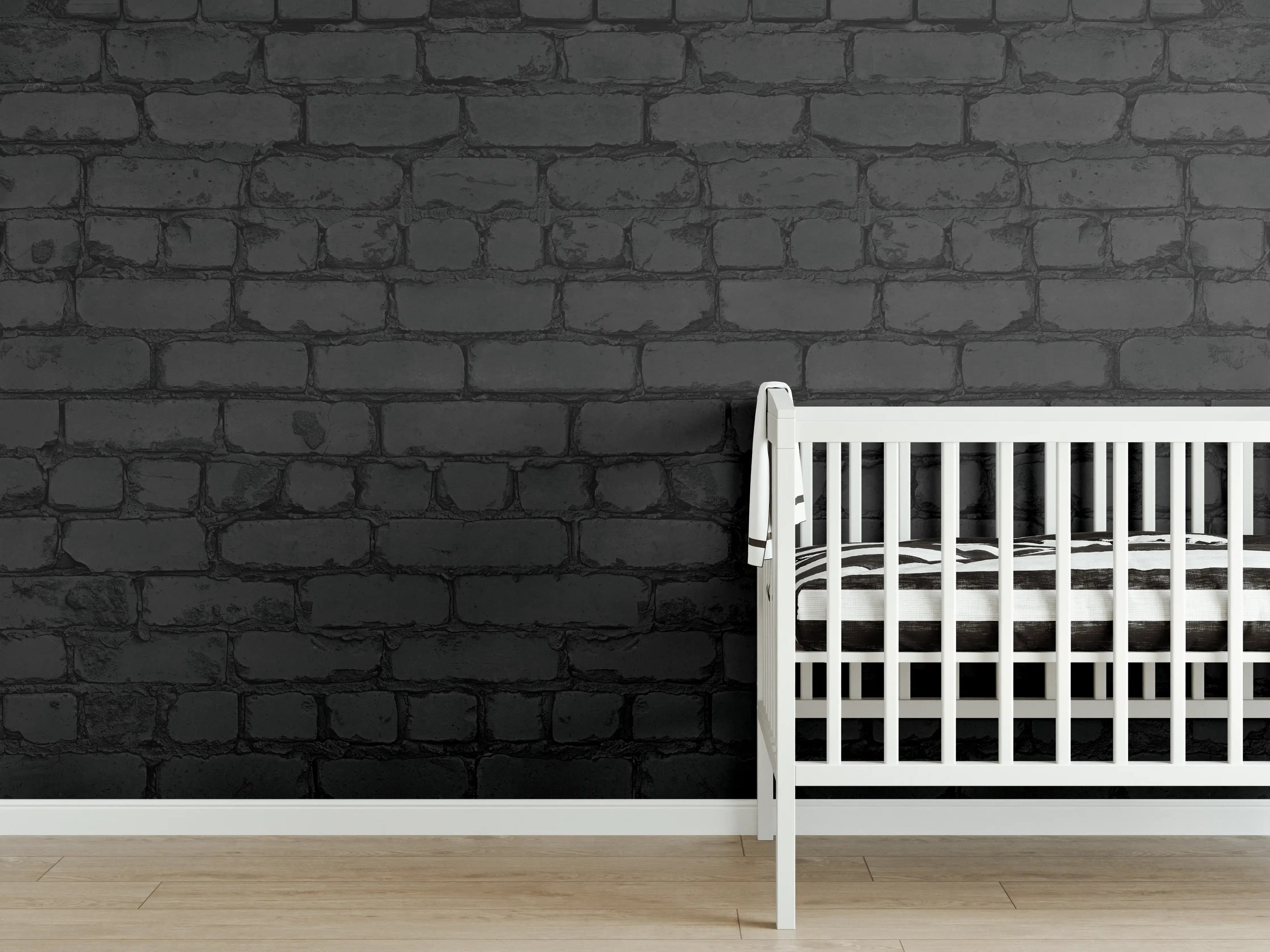 Babyzimmer Wandgestaltung - Schwarze raue Backsteinmauer