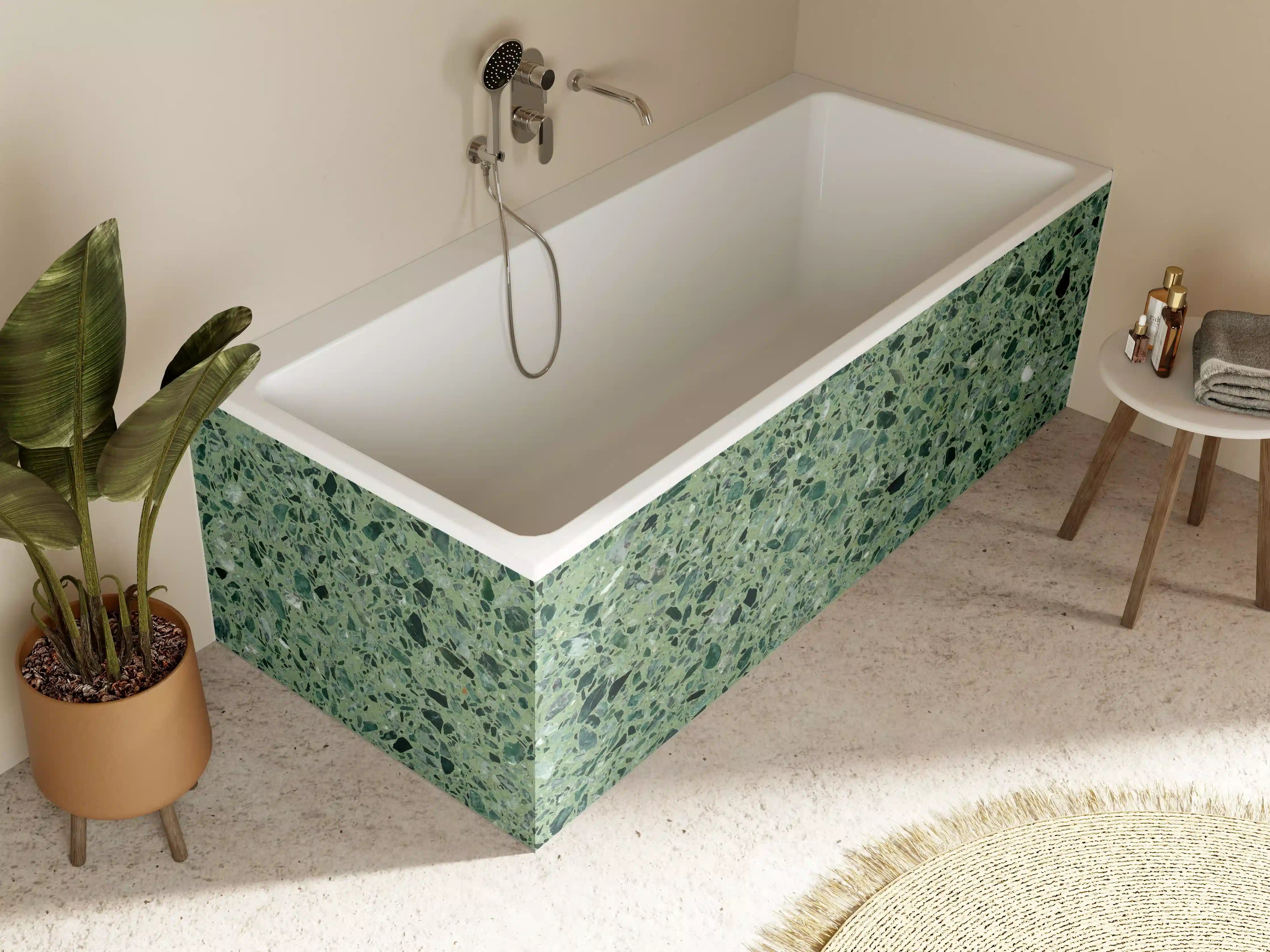 Badewannen-Rückwand - Terrazzo Textur auf türkisem Hintergrund