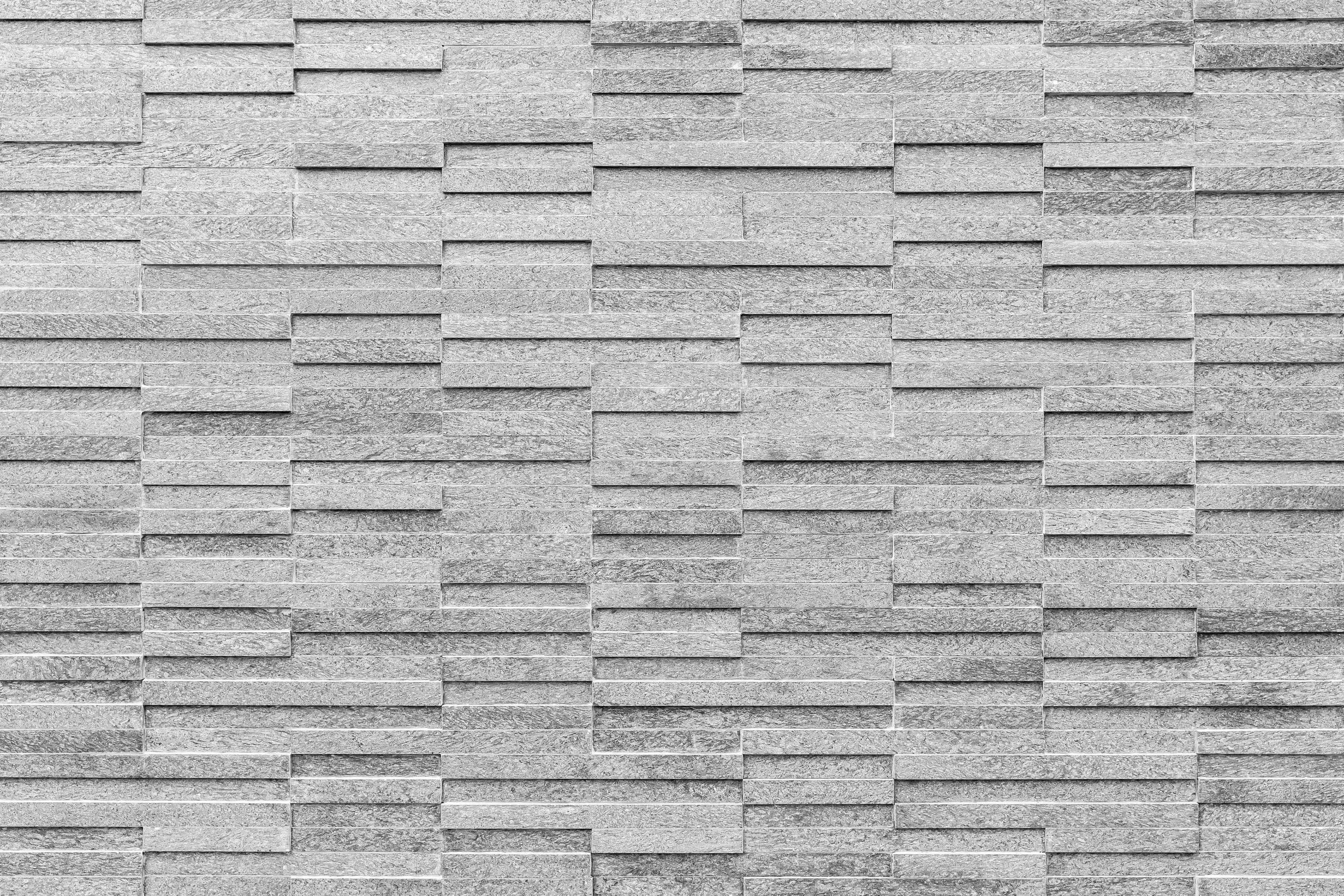 Büro Wandgestaltung-Geriffelte gräuliche Backsteinmauer