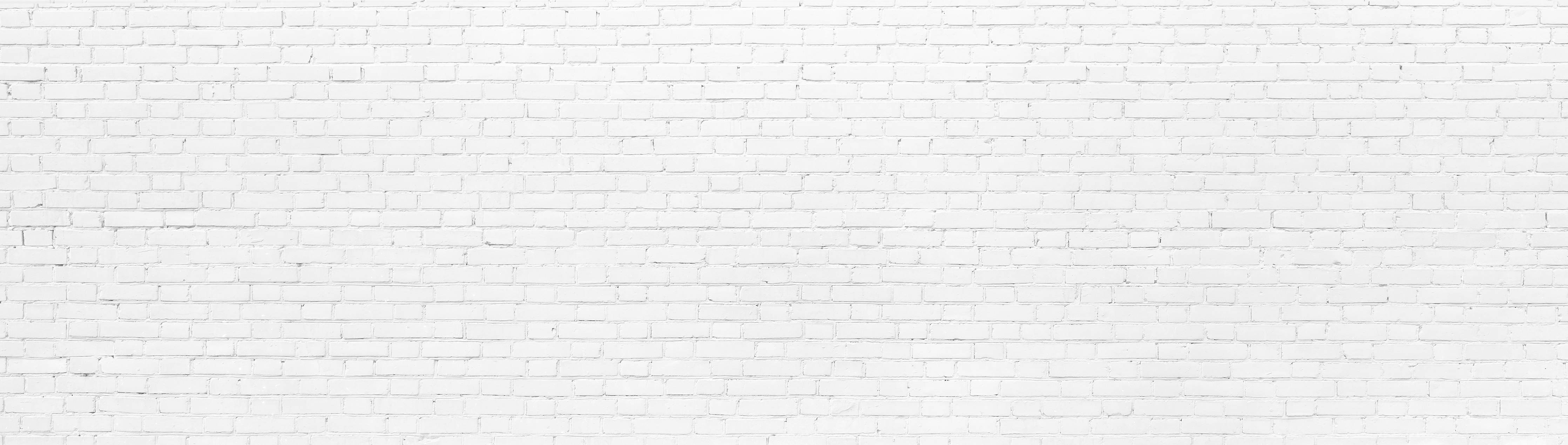 Büro Wandgestaltung-Weiße Backsteinmauer mit subtiler Struktur