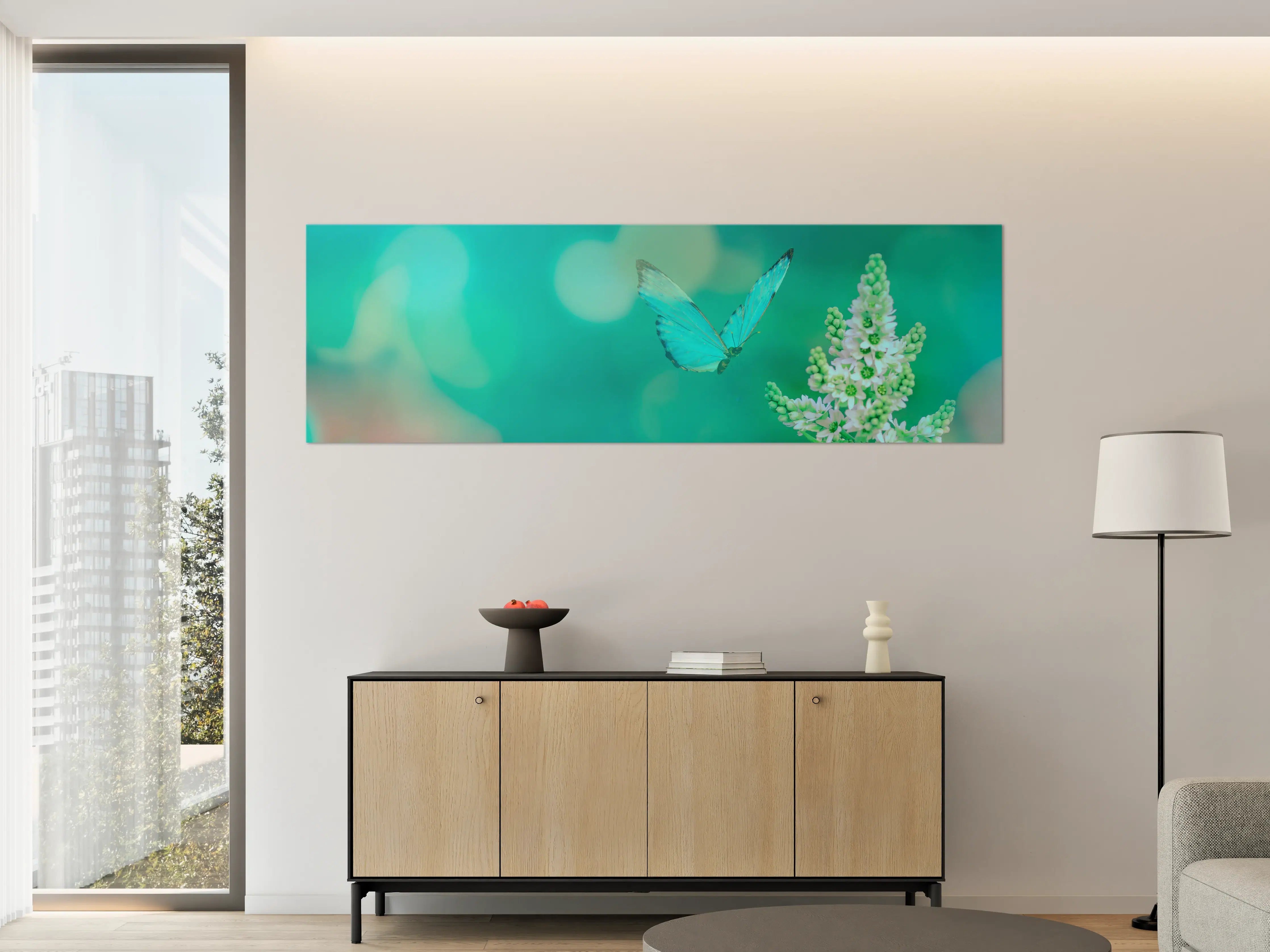 Große Wandbilder - Blaue Schmetterlinge über Blumen in zartem Türkis