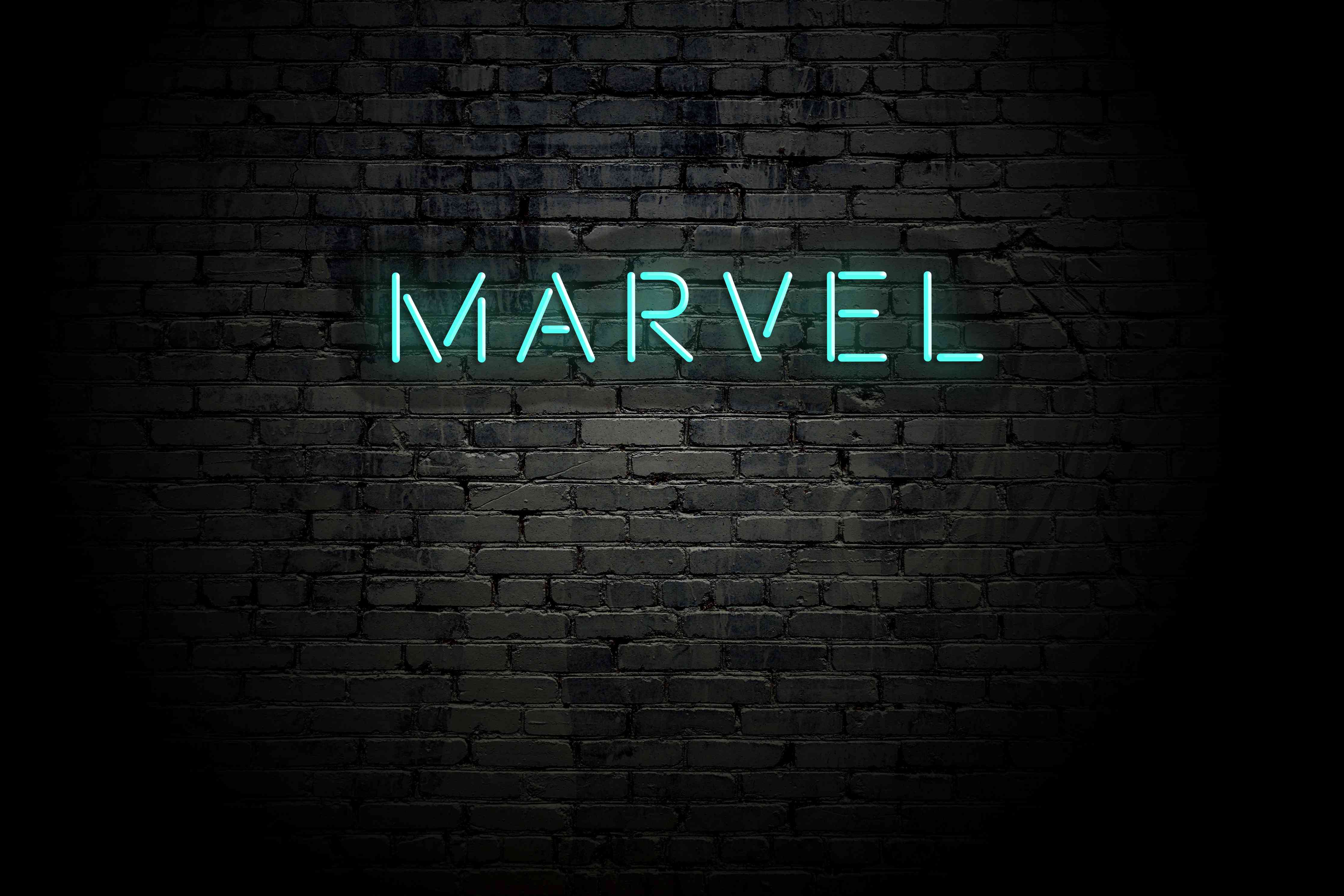 Große Wandbilder-Dunkle Backsteinmauer mit "Marvel" Aufschrift