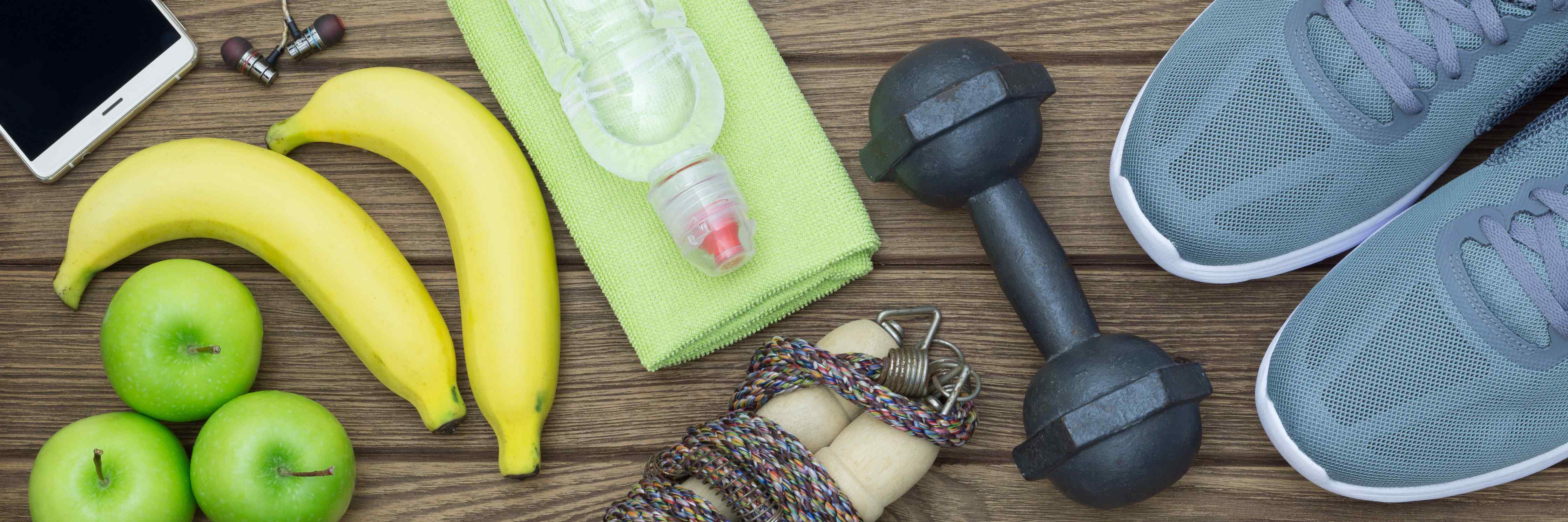 Große Wandbilder-Fitness- und Gesundheitsszene mit Bananen und Hanteln