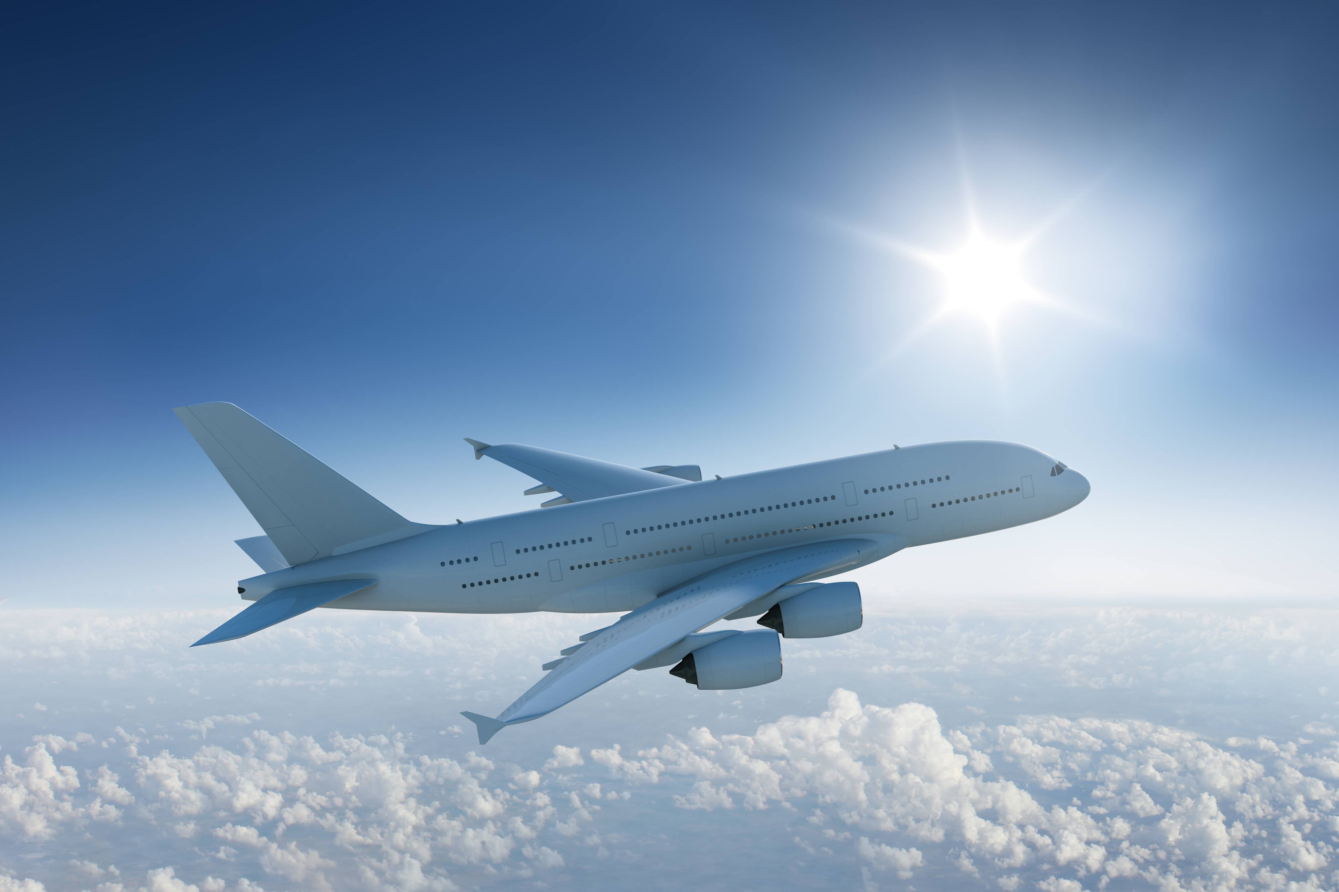 Große Wandbilder-Flugzeug über weißen Wolken