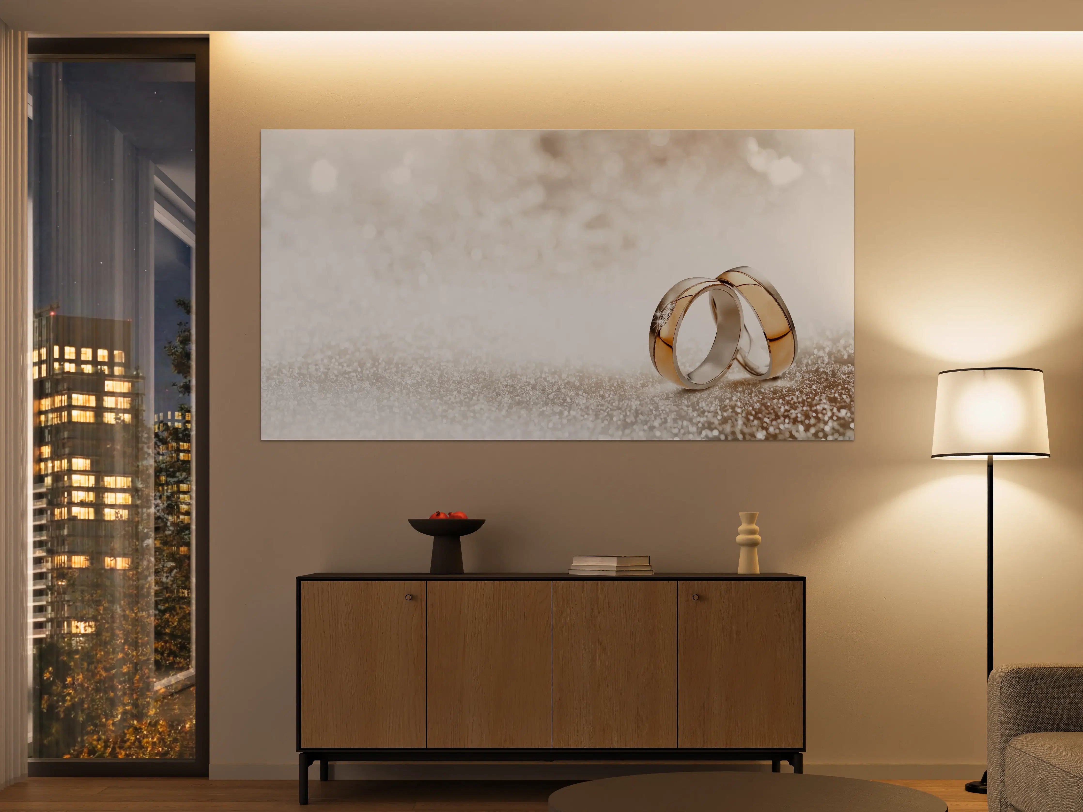 Große Wandbilder - Zwei goldene Eheringe mit Glitter Hintergrund