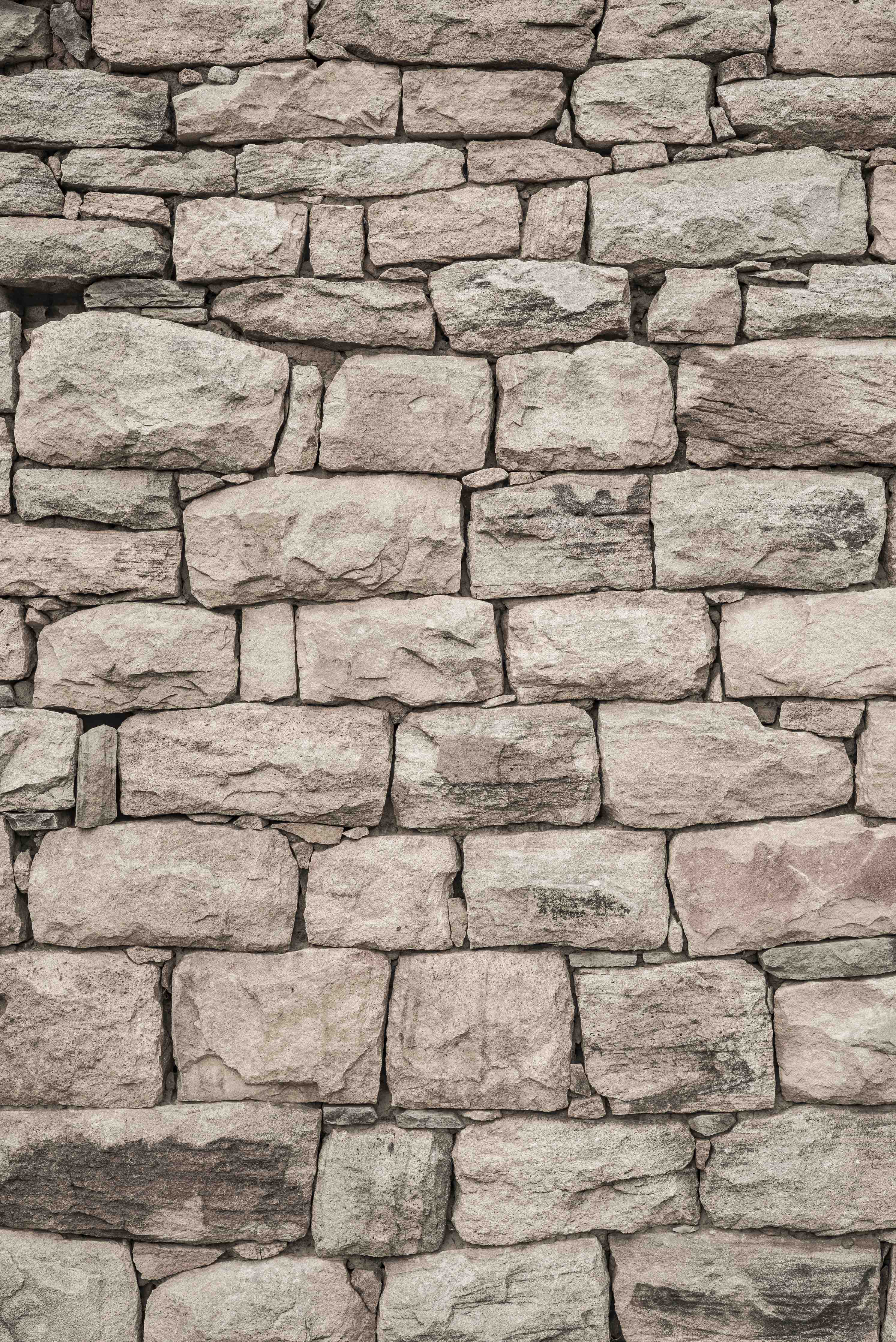 Kinderzimmer Wandgestaltung-Beige Natursteinmauer mit texturierter Oberfläche