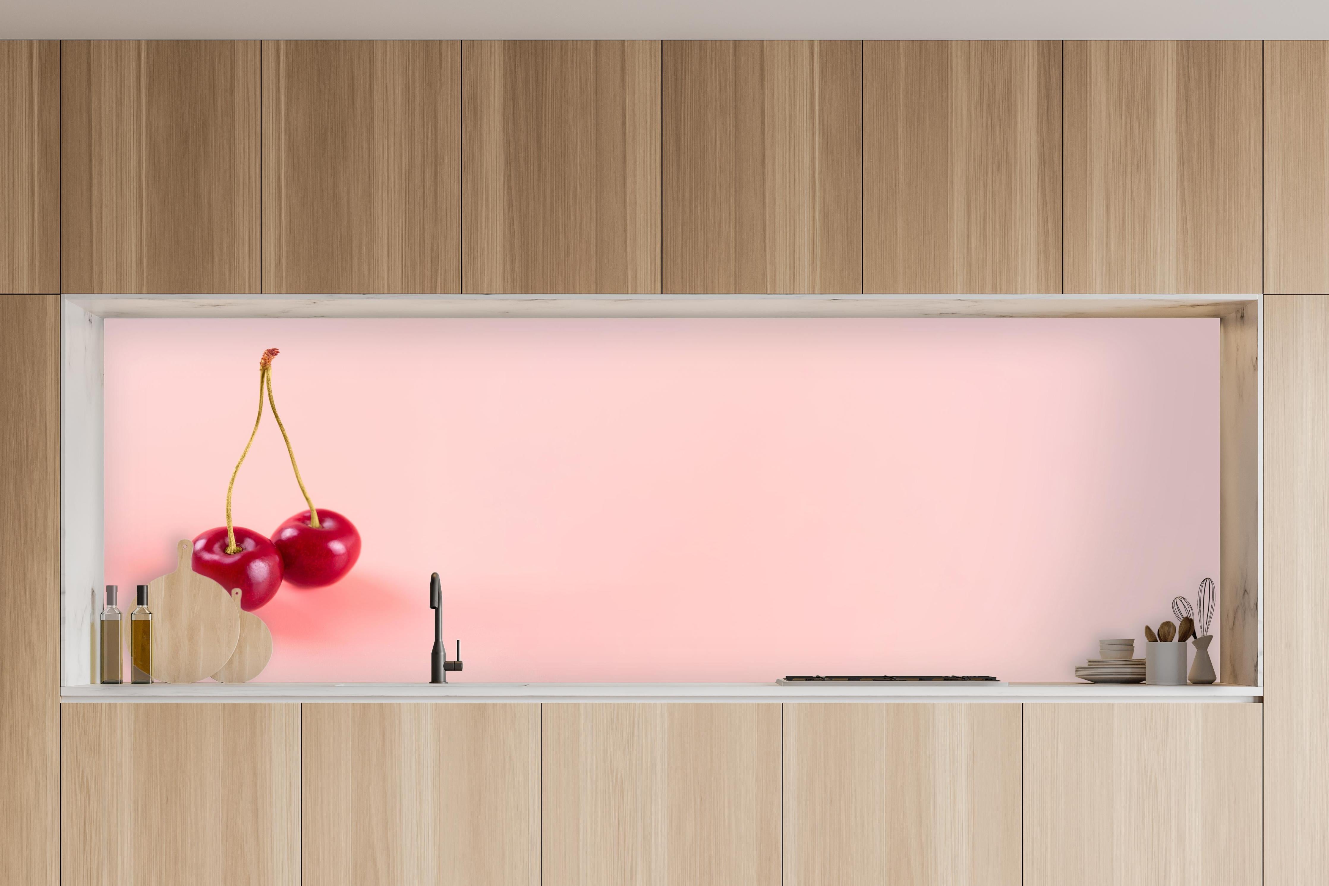 Küche - Rote Kirschen auf Rosa Hintergrund in charakteristischer Vollholz-Küche mit modernem Gasherd