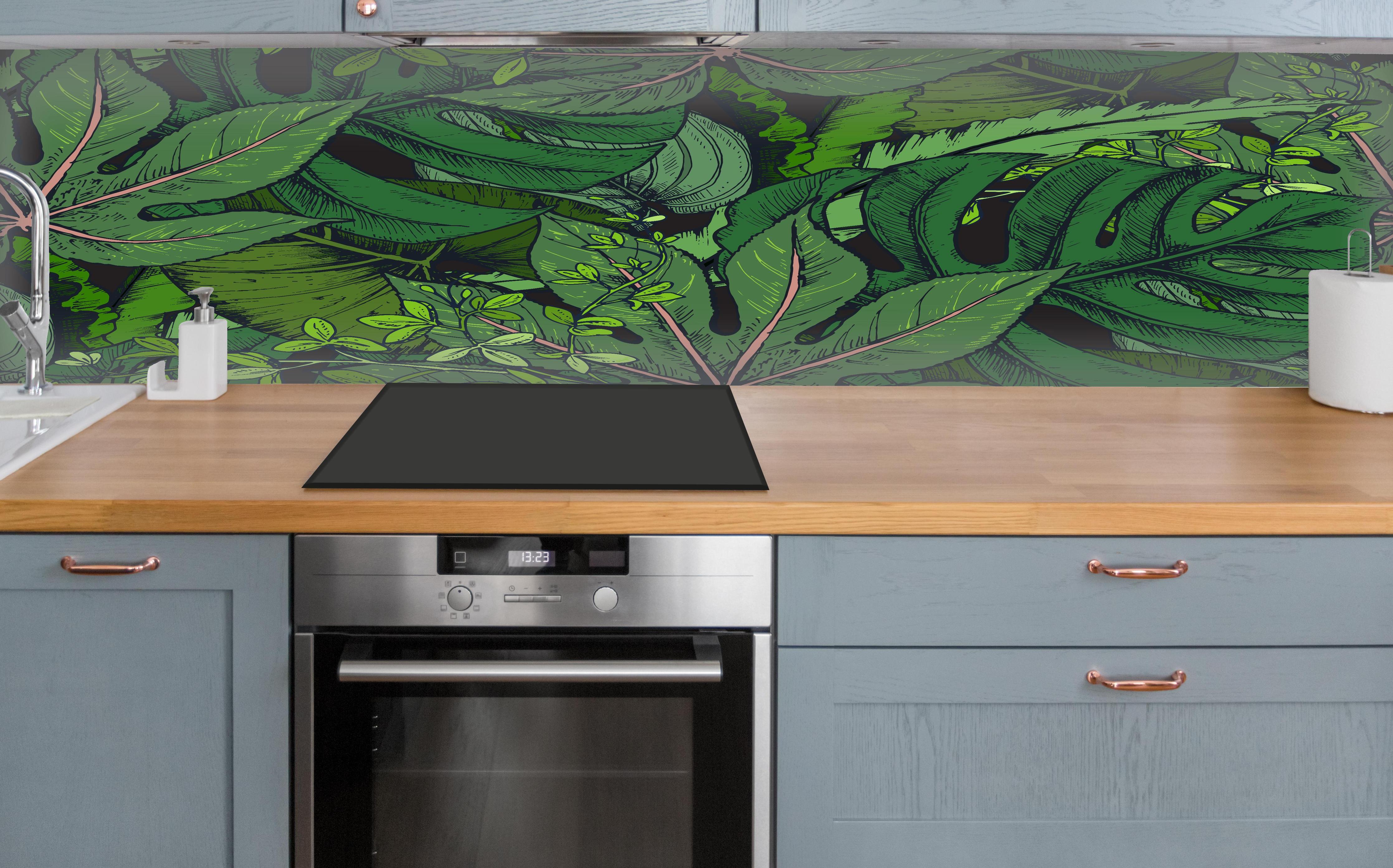 Küche - Tropische Monstera-Blätter Grün über polierter Holzarbeitsplatte mit Cerankochfeld