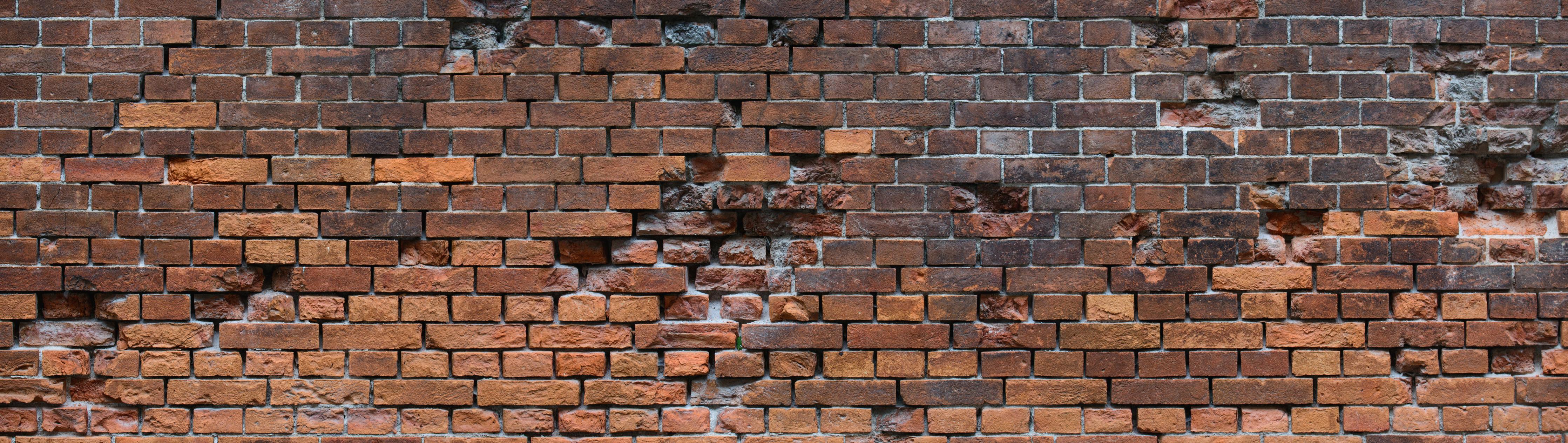 Küchenrückwand-Braune kaputte Ziegelsteinwand