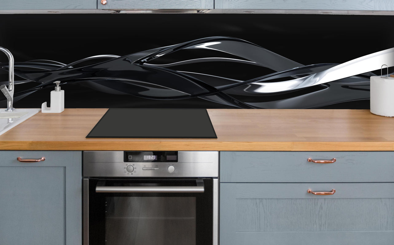 Küche - Elegant fließende Bewegung über polierter Holzarbeitsplatte mit Cerankochfeld