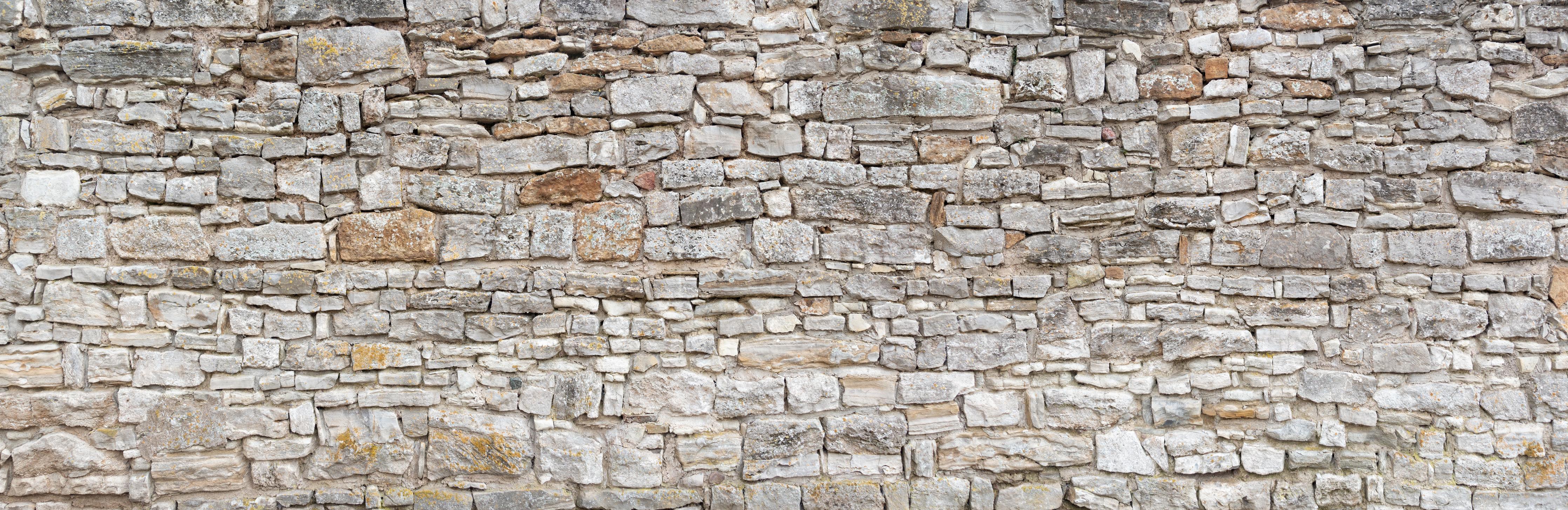 Küchenrückwand-Gräuliche alte Mauer aus groben Steinen