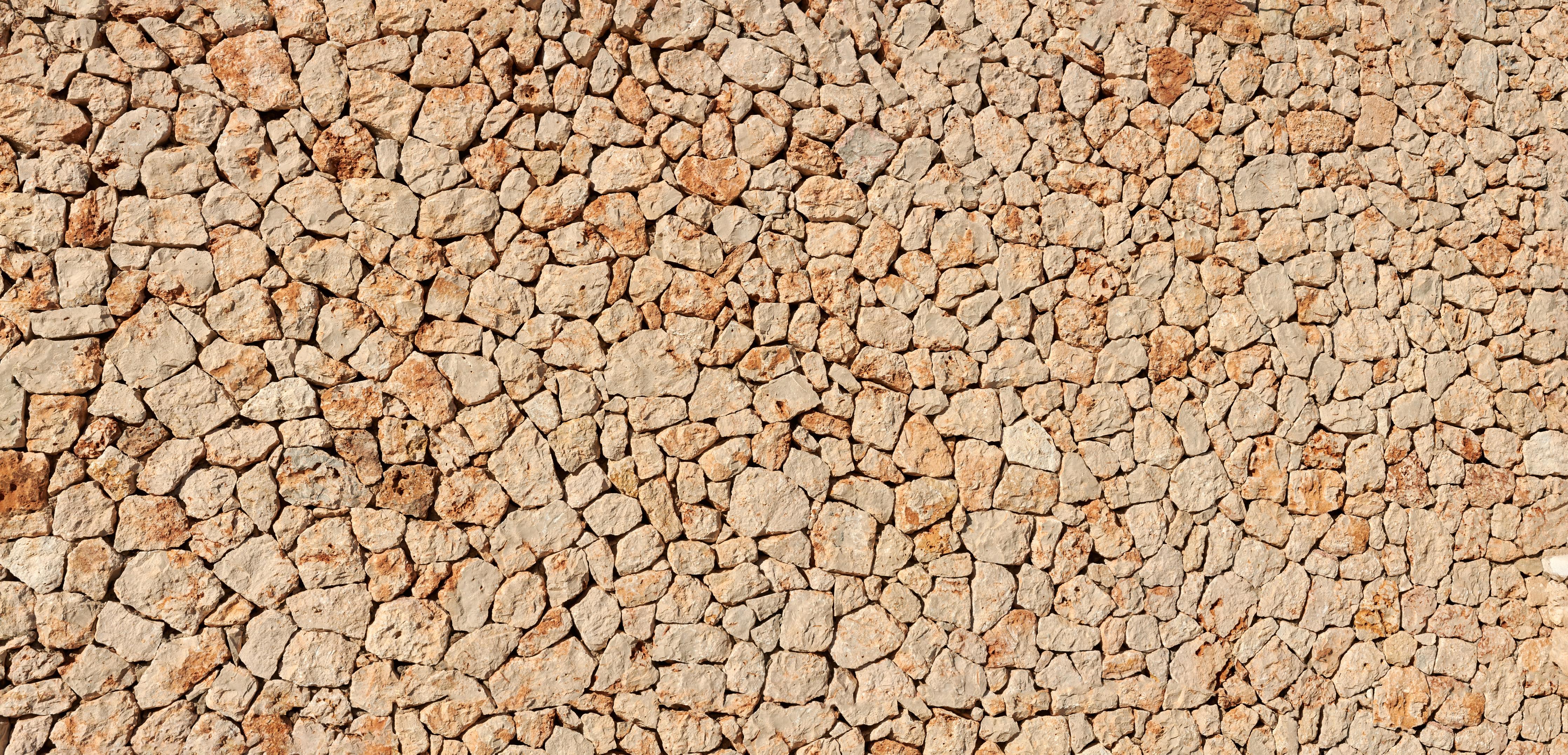 Spritzschutz-Bräunliche Panorama-Textur Steinmauer