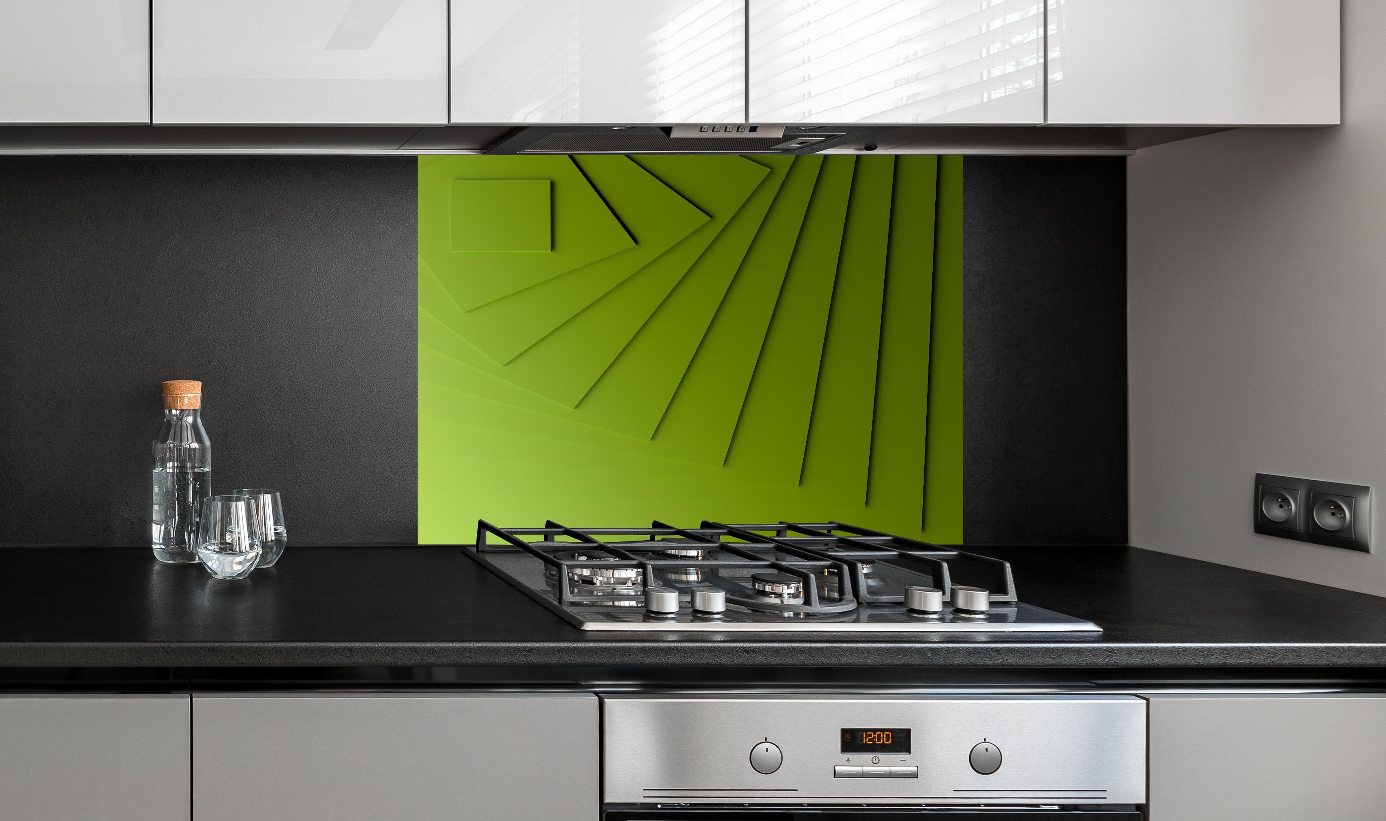 Spritzschutz - Grüner Moderner Hintergrund  hinter einem Cerankochfeld zwischen Holz-Kochutensilien
