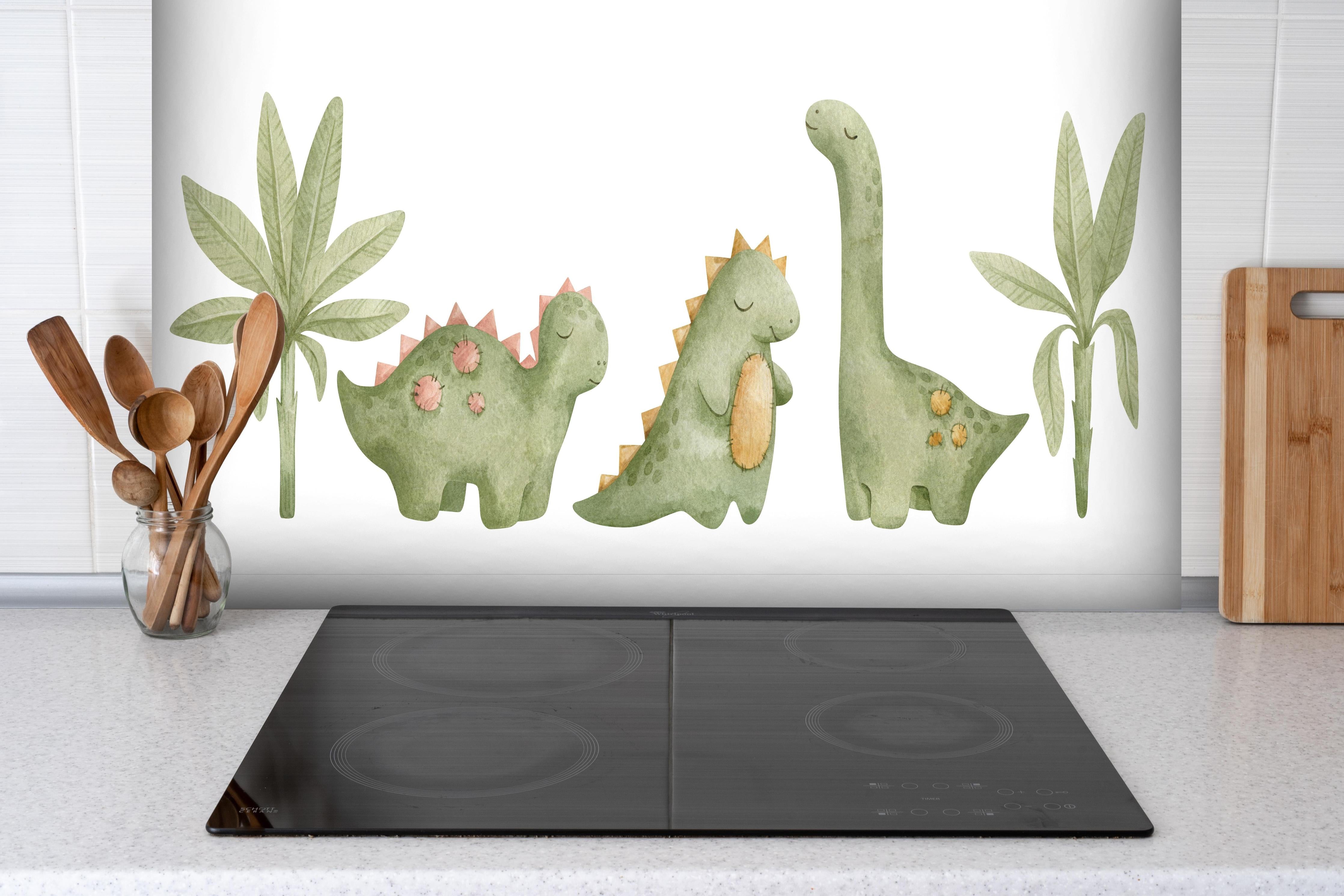 Spritzschutz - Niedliche Dinosaurier hinter einem Cerankochfeld zwischen Holz-Kochutensilien
