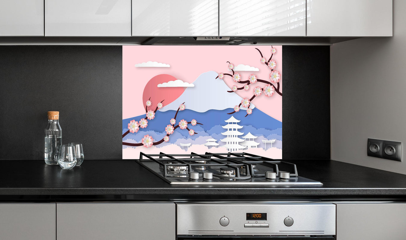 Spritzschutz - Papierkunst Japan Berge Sakura Sonnenuntergang hinter einem Cerankochfeld zwischen Holz-Kochutensilien

