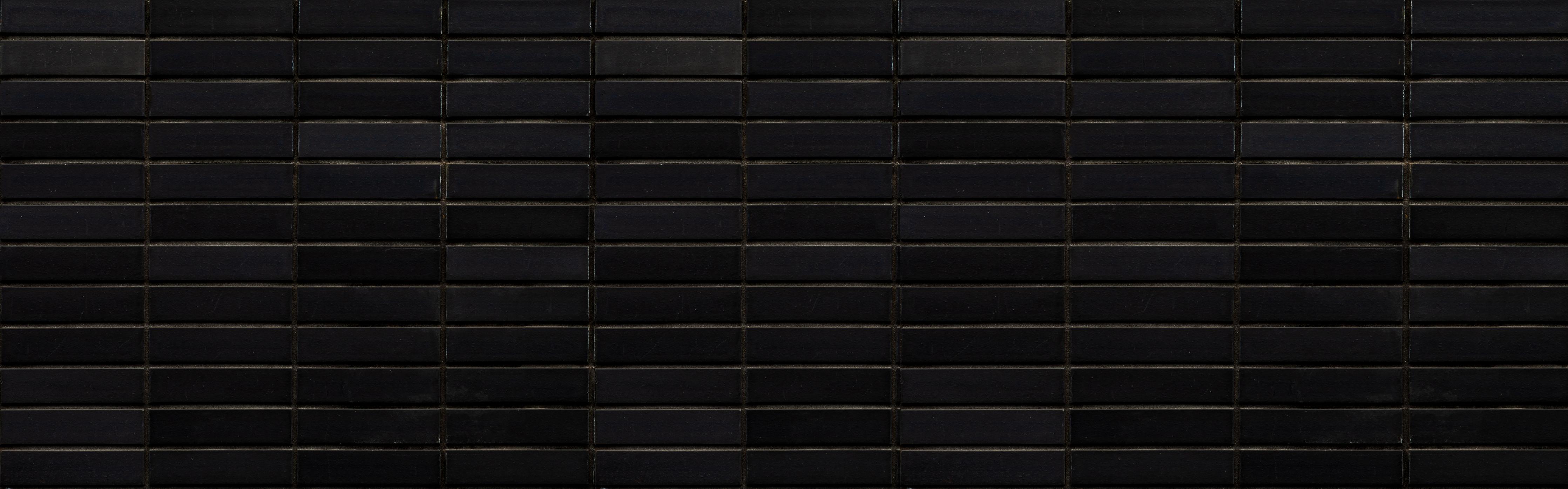 Spritzschutz-Schwarze Backsteinmauer mit goldener Akzent