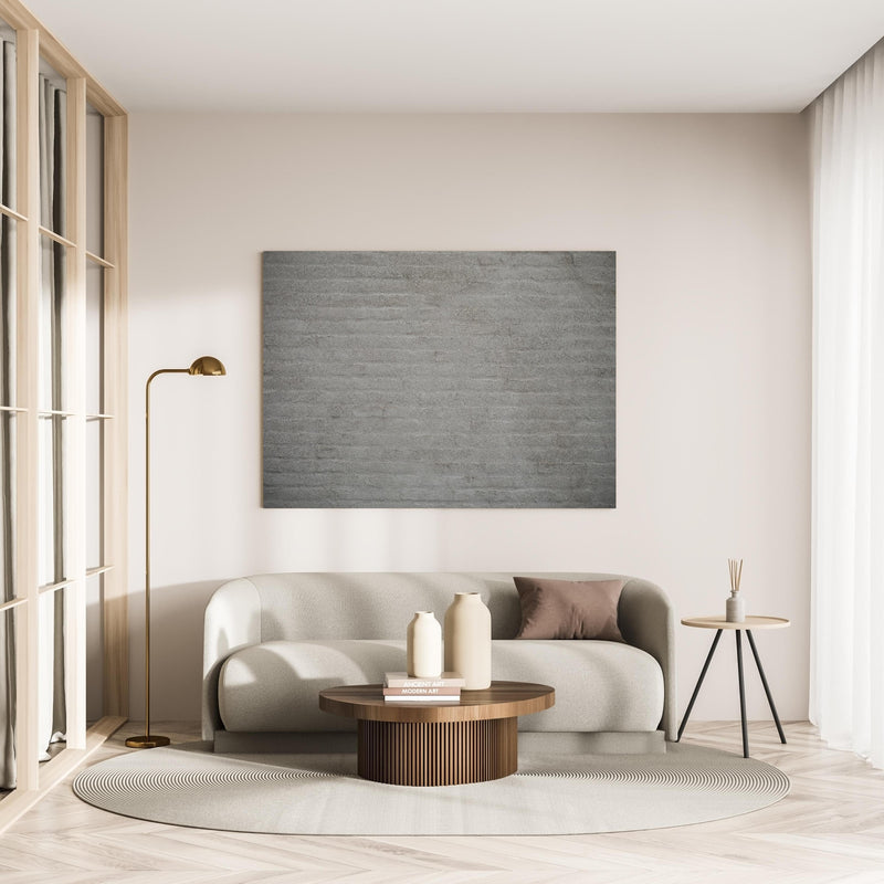 Wandbild - Gräuliches Mauerwerk in minimalistisch eingerichtetem cremefarbenen Wohnzimmer