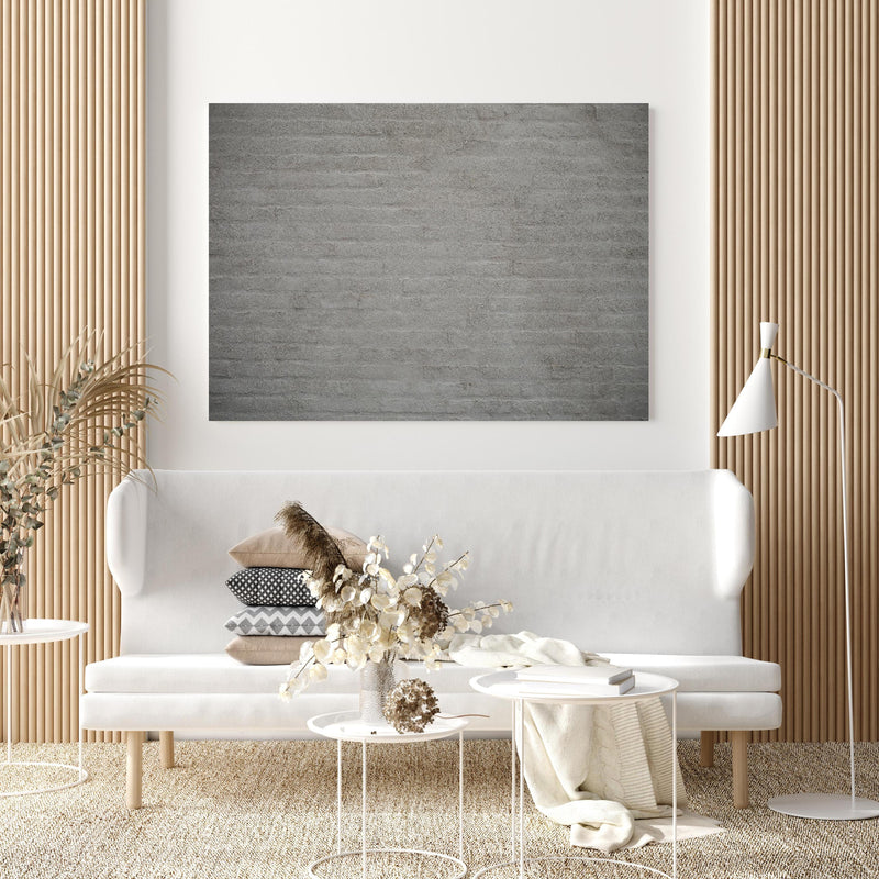 Wandbild - Gräuliches Mauerwerk in extravagant gestaltetem Raum mit minimalistischer Couch-quadratisch