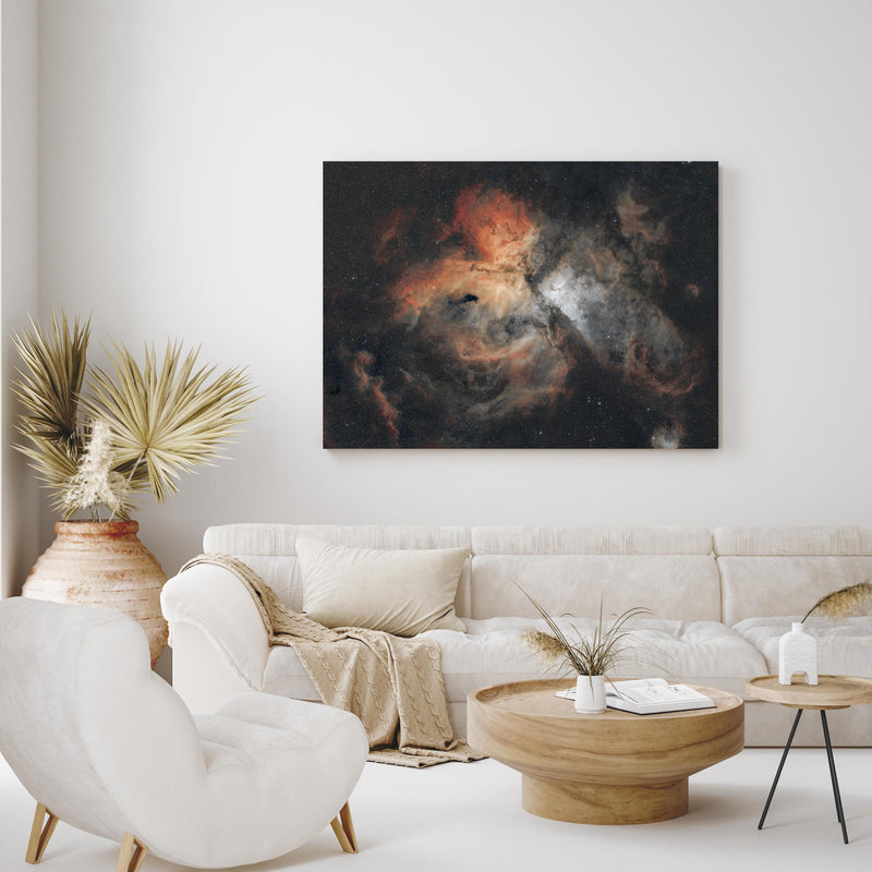 Wandbild - Great Carina Nebula in exotisch eingerichtetem Wohnzimmer über gemütlicher Couch