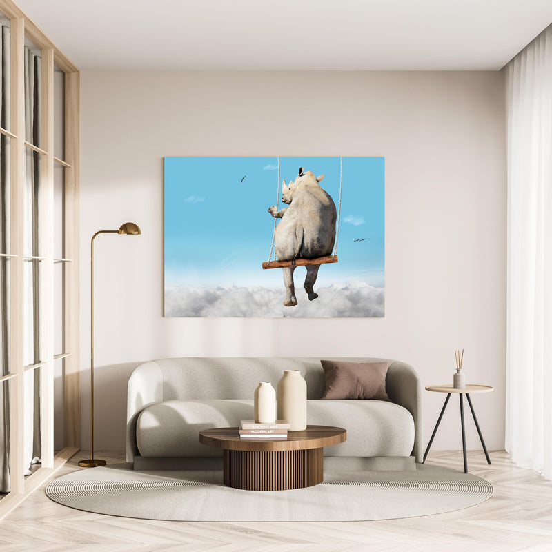 Wandbild - Nashorn schaukelt über den Wolken in minimalistisch eingerichtetem cremefarbenen Wohnzimmer