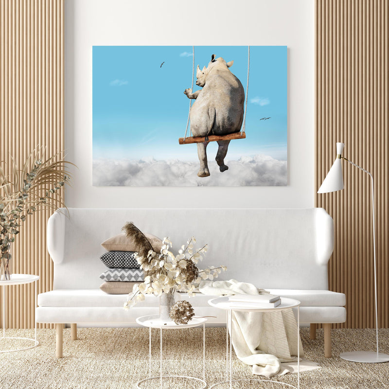 Wandbild - Nashorn schaukelt über den Wolken in extravagant gestaltetem Raum mit minimalistischer Couch-quadratisch