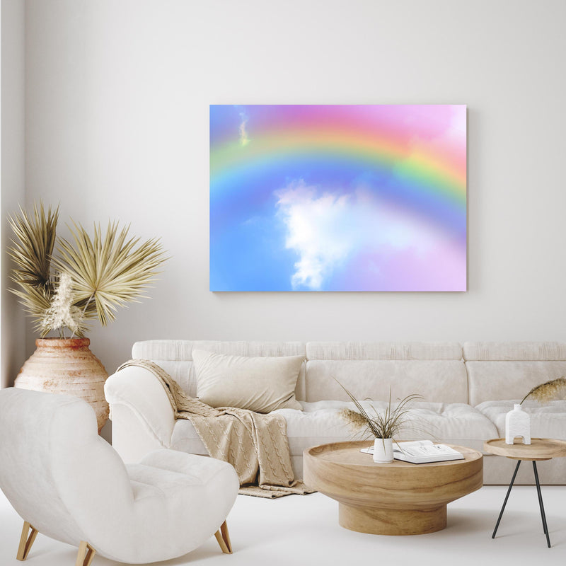 Wandbild - Regenbogen im Wolkenhimmel in exotisch eingerichtetem Wohnzimmer über gemütlicher Couch