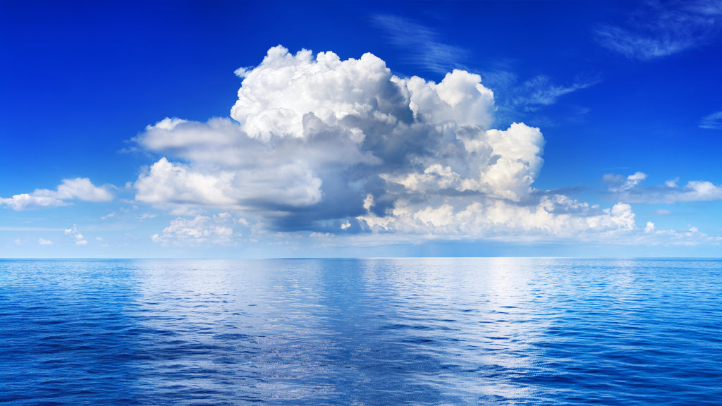 Wandbild-Wolkenkulisse über dem Ozean