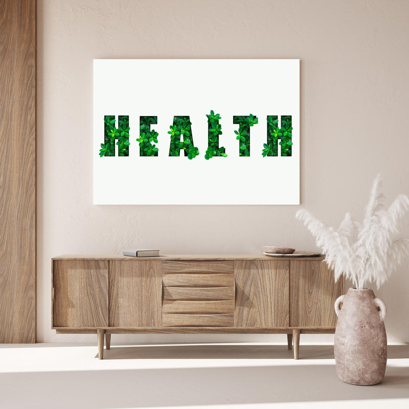 Wandbild - Wort HEALTH aus grünen Blättern über Holzkommode hinter dekorativer Zimmerpflanze