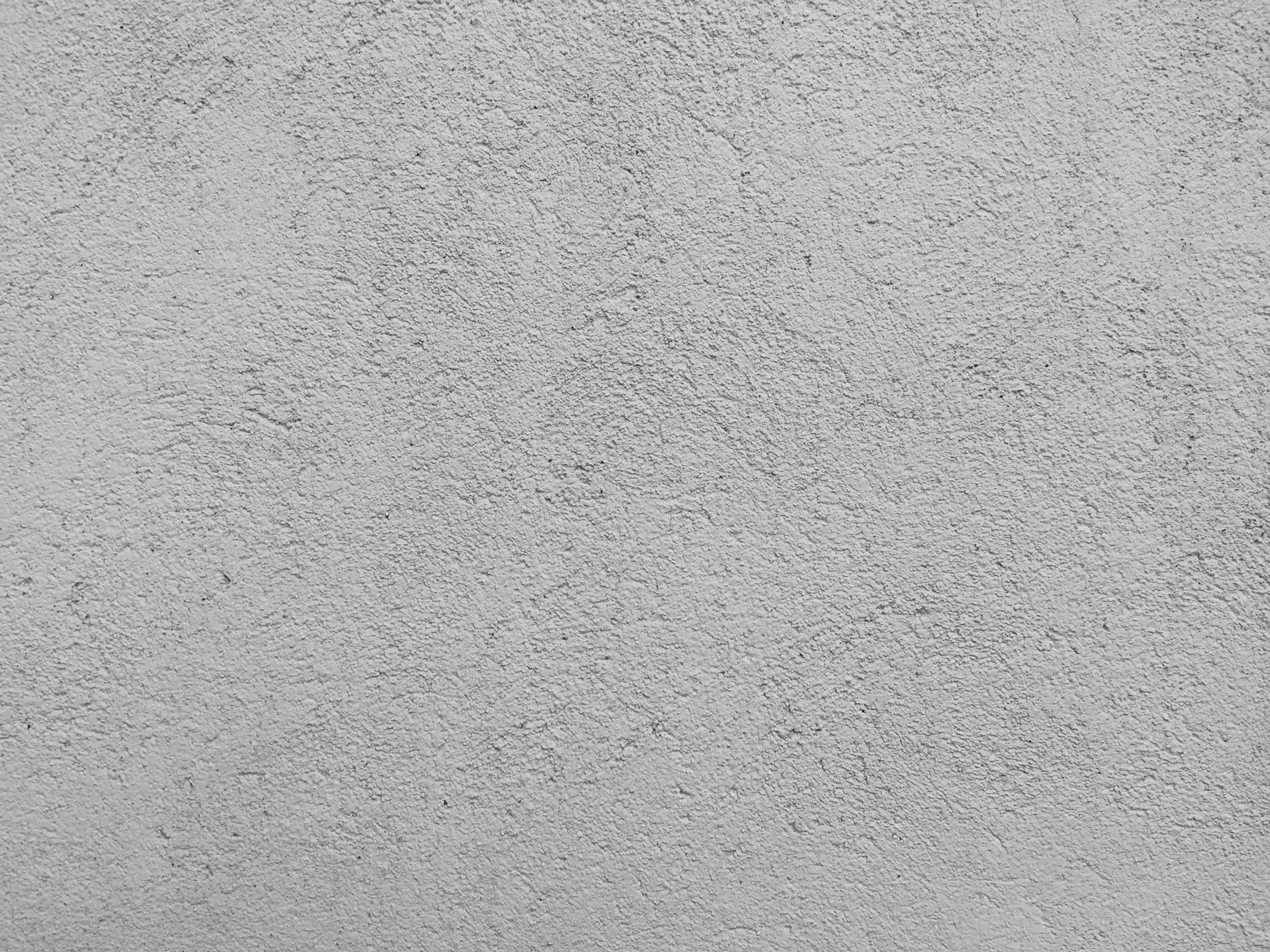 Wandverkleidung Bad-Helle, graue Putzwand mit Textur