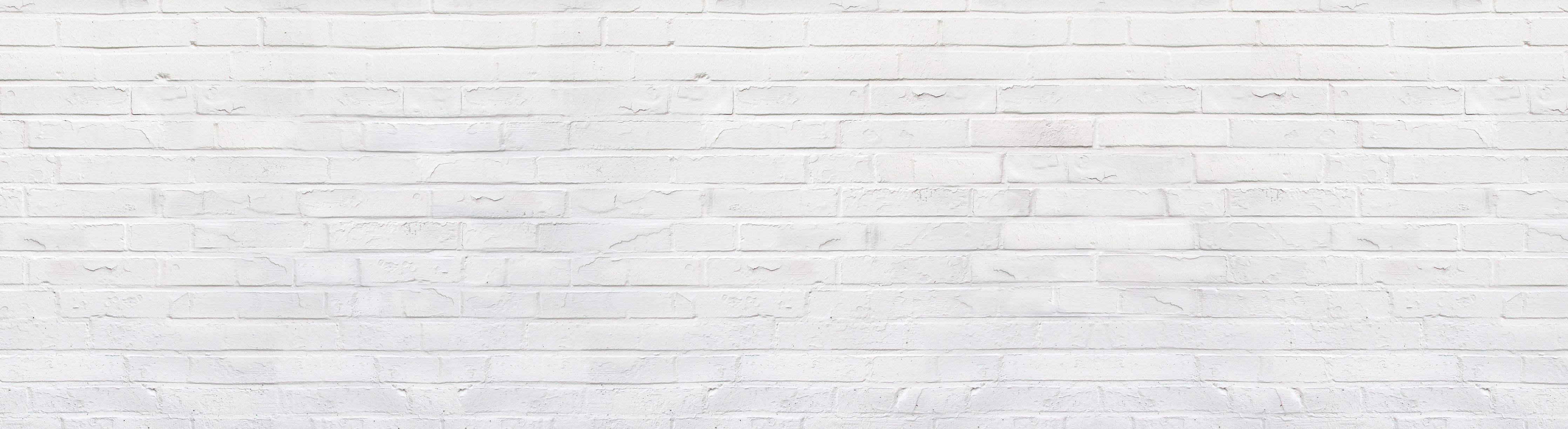 Wandverkleidung Schlafzimmer-Weiße zerschlagene Ziegelsteinmauer