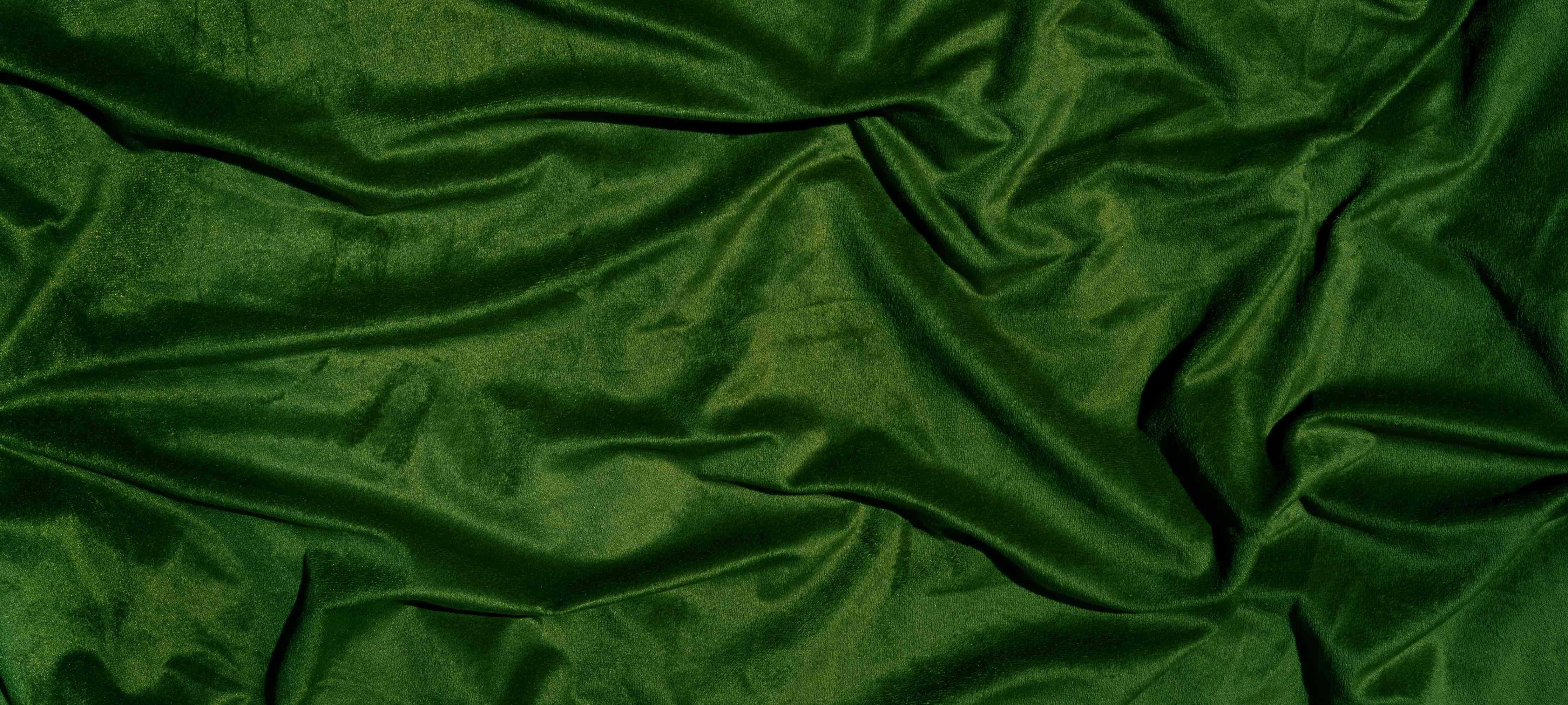 Wandverkleidung Wohnzimmer-Grüner Seidenstoff Hintergrund