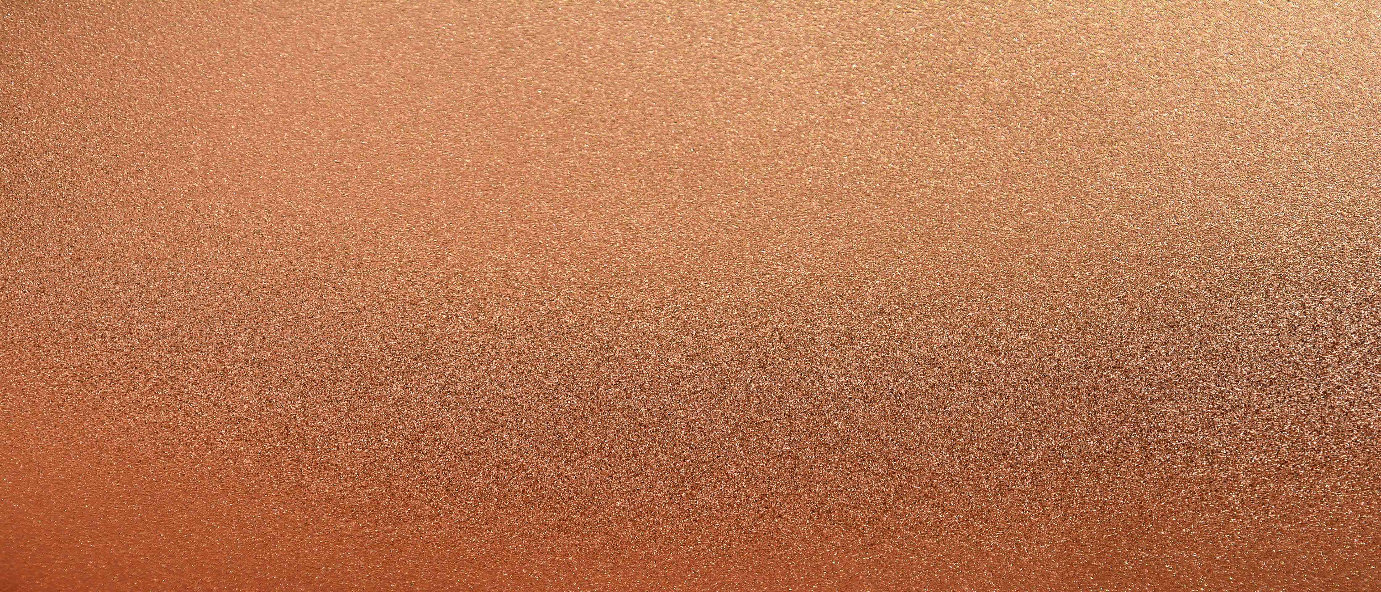 Wandverkleidung Wohnzimmer-Kupferfarbener Hintergrund mit warmen Tönen