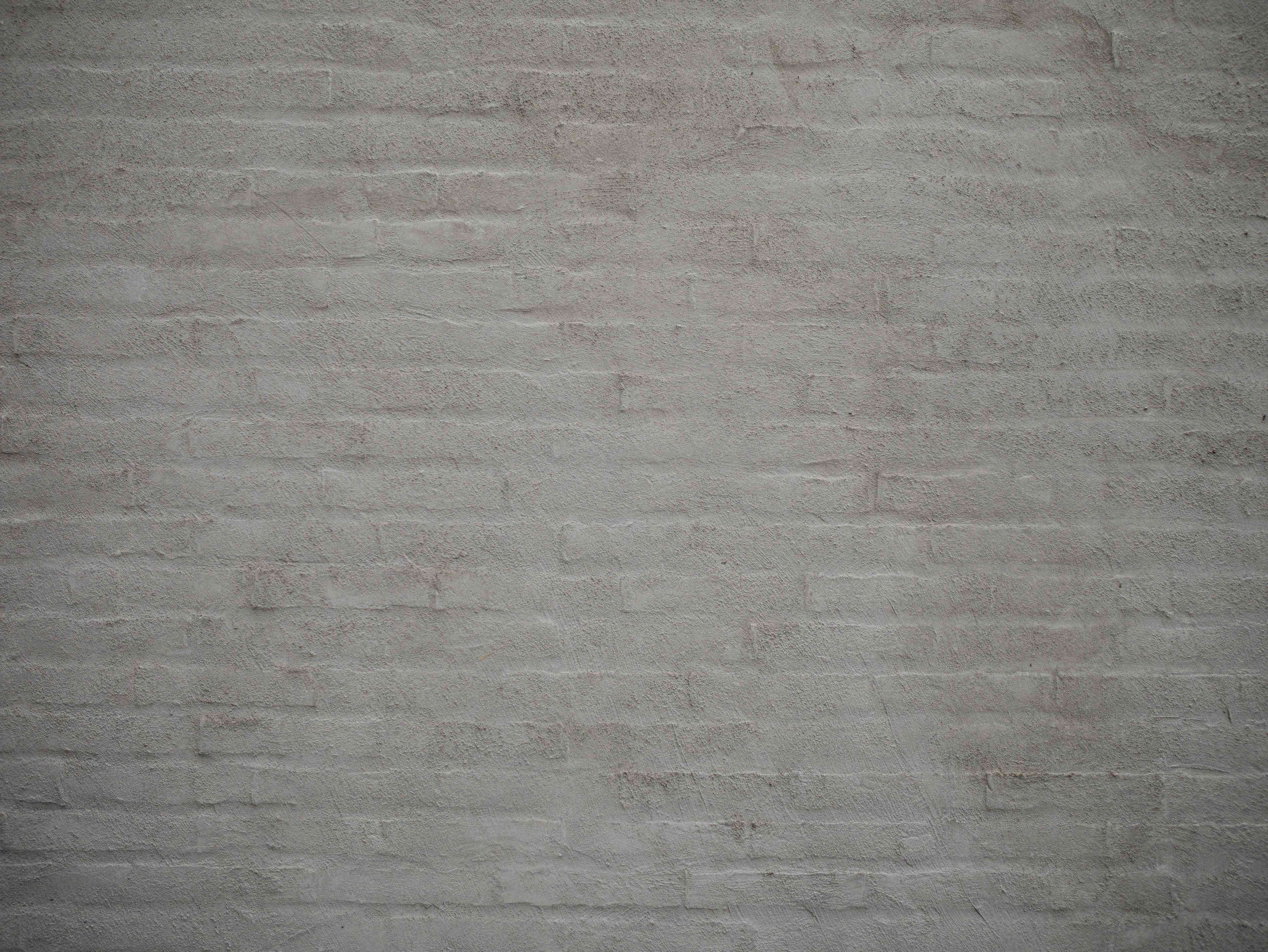 Wandverkleidung Wohnzimmer-Moderner grauer Ziegelsteinwand-Hintergrund