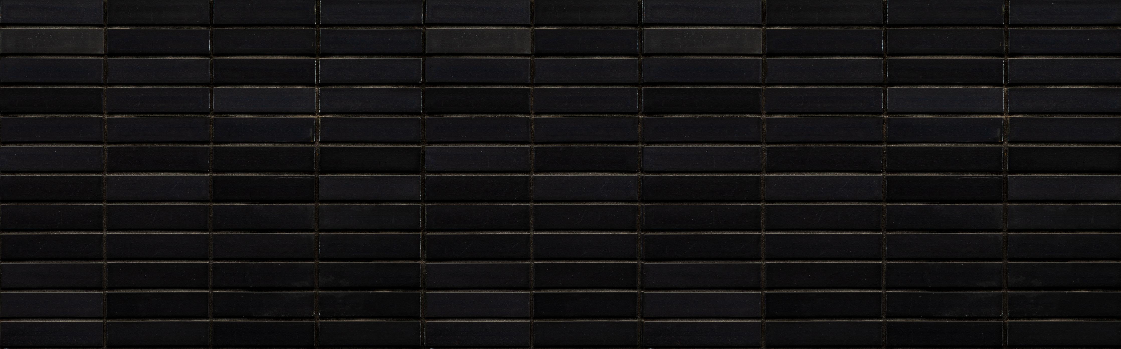 Wandverkleidung Wohnzimmer-Schwarze Backsteinmauer mit goldener Akzent