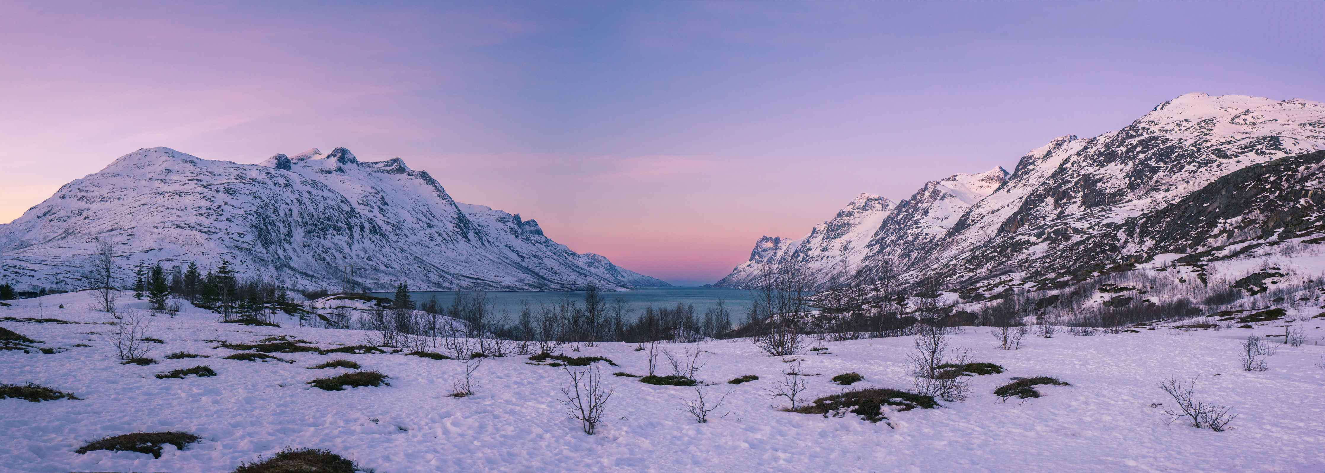 Wandverkleidung Wohnzimmer-Sonnenuntergang über verschneiten Bergen