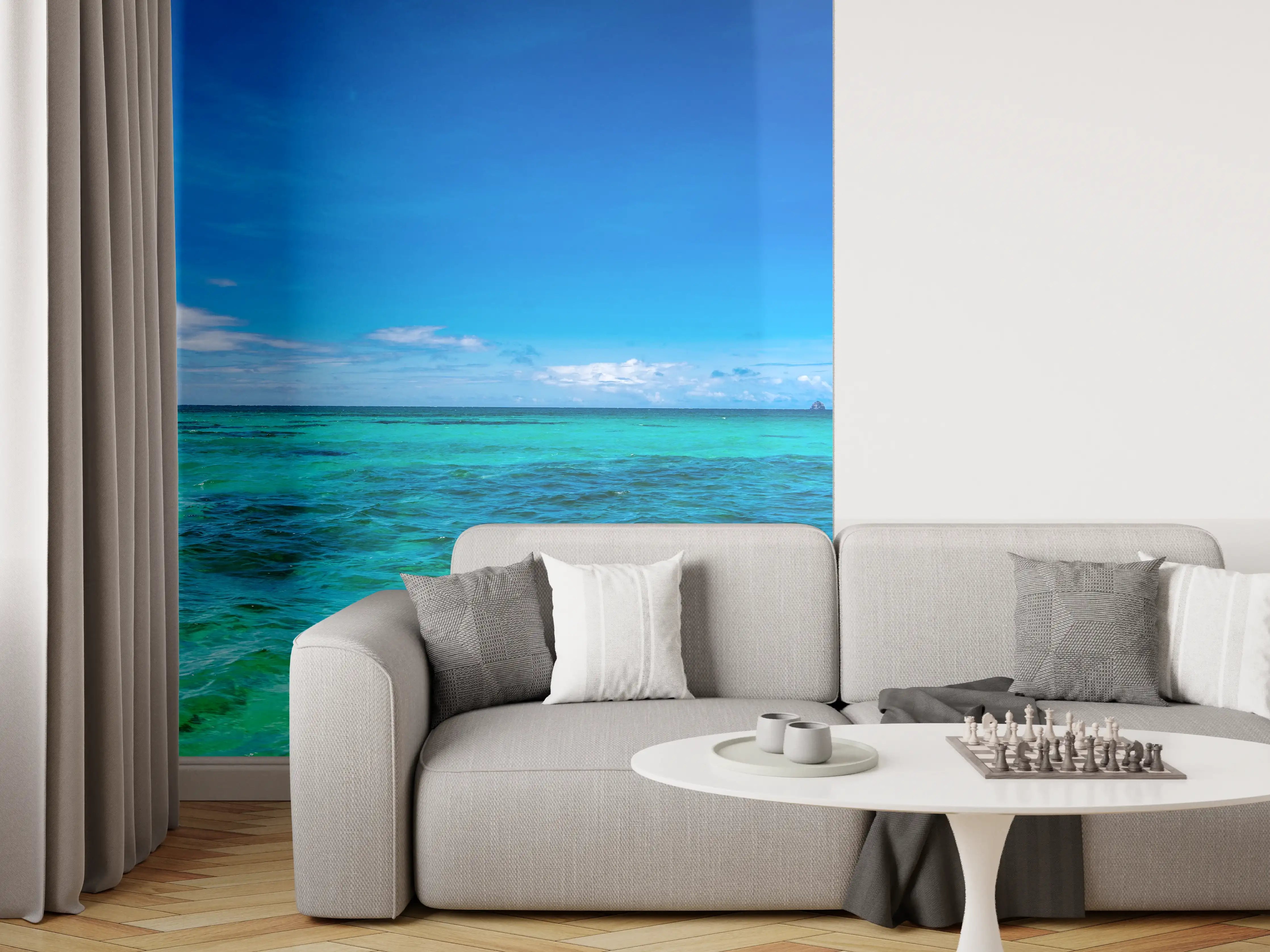 Wandverkleidung Wohnzimmer - Türkisblaues Wasser unter klarem Himmel