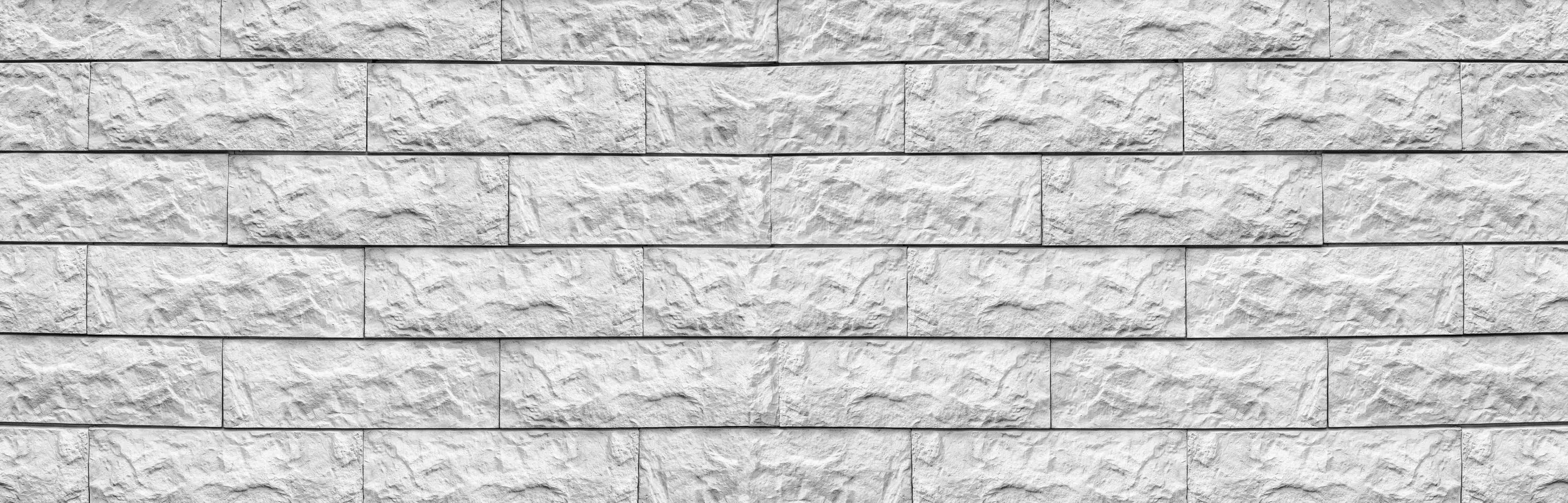 Wandverkleidung außen-Weißes Mauerrelief mit Grautönen